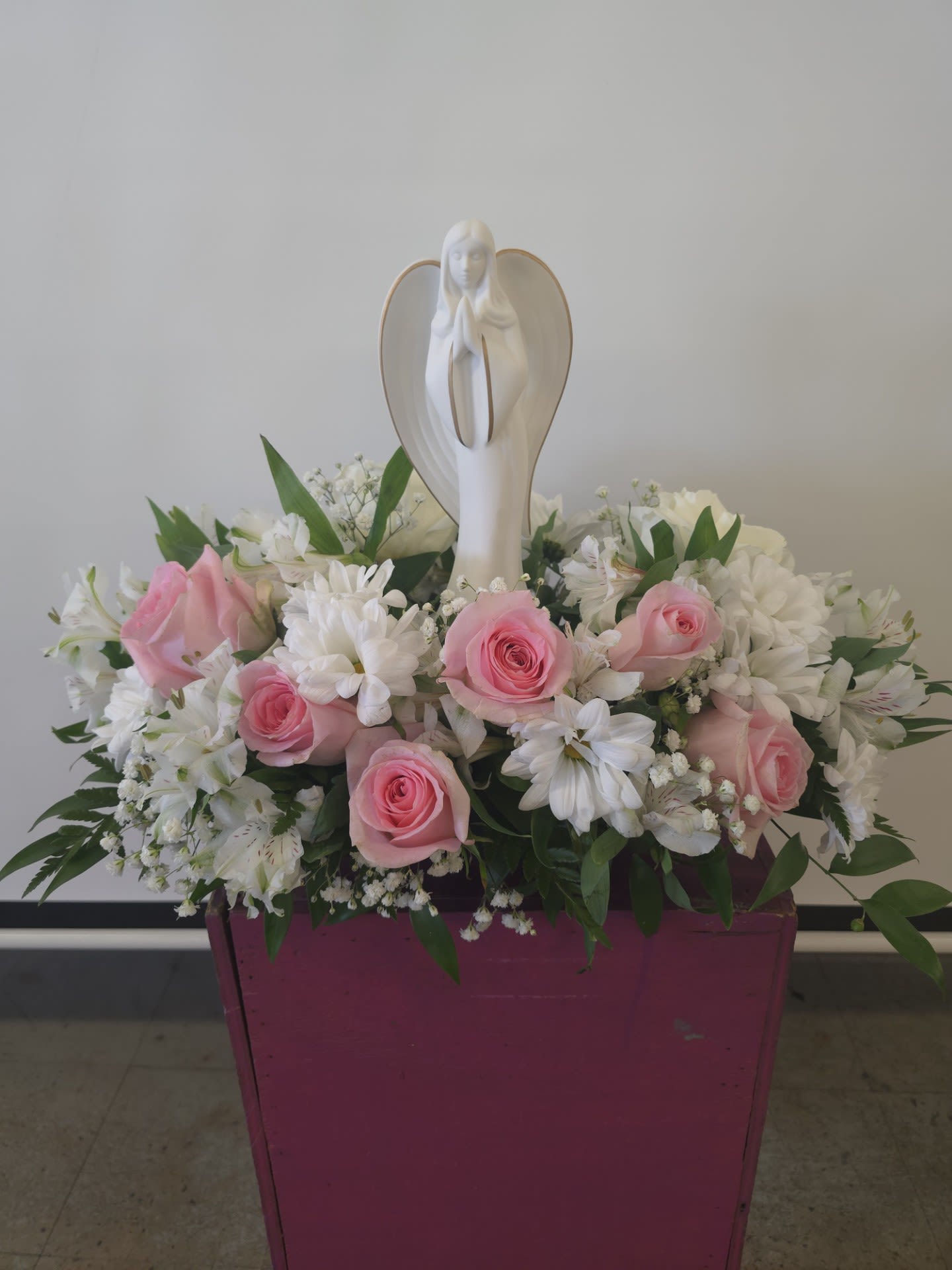 Guardian Angel bouquet pink Guardian Angel bouquet pink - send deepest thoughts & sympathies with this beautiful white & pink arrangement with guiding Angel set on top.