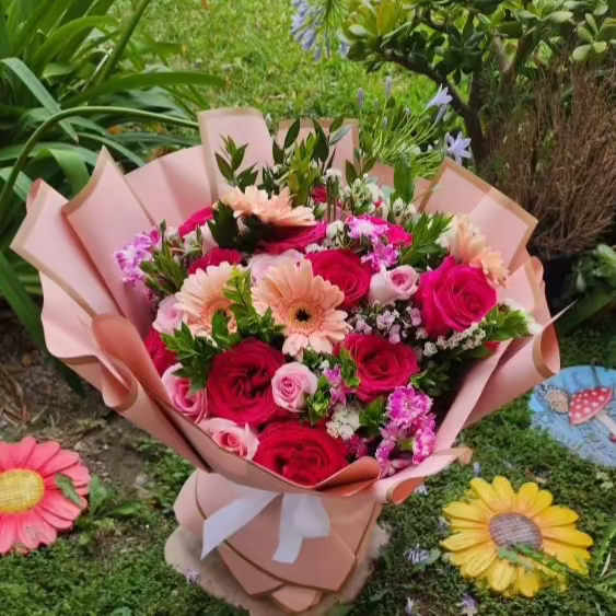 Cat Friendly Blooms - This wrap bouquet shown in large. 2 dozen roses designer's choice. All florals are cat friendly. 