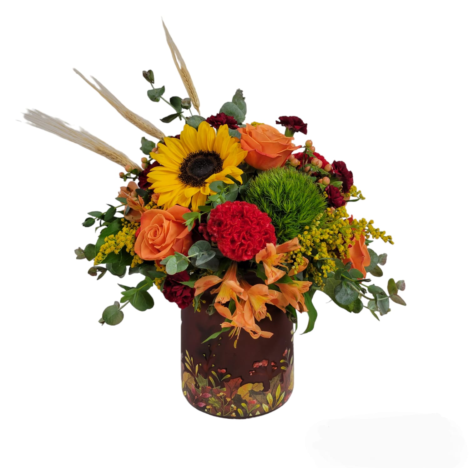 AUTUMN CRISP - This arrangement is designed in an Autumn decorative vase. It will consist of fall flowers such as sunflowers, dianthus, coxcomb, alstromeria, golden rod hypericum berries and more to create a lush fall arrangement for your loved one.