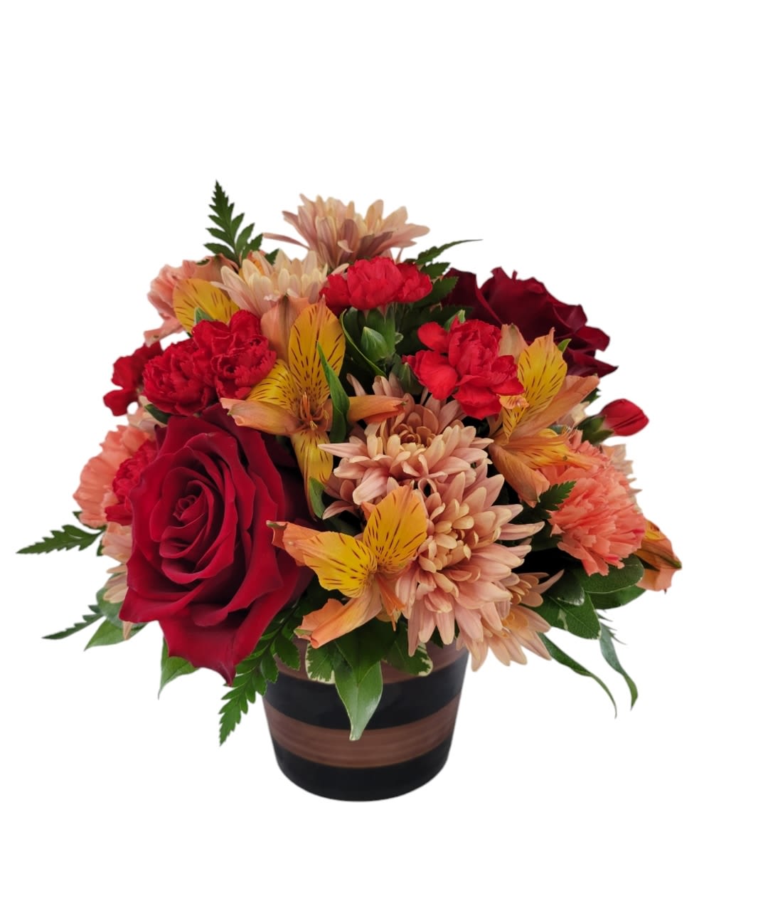 Full of Fall - Chrysanthemums, alstromeria, roses and minicarns in fall colors of bronze, red and orange. Designed in a black and bronze striped ceramic container.