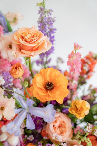 Summer color Designer's Choice Summer color Designer's Choice - Step into the beauty of summer with our Designers' Choice Flower Arrangement! Bursting with vibrant hues and bright, this carefully curated bouquet captures the essence of the season. A perfect blend of freshness, warmth, and color to brighten any space. Let the flowers tell your spring story! Our floral artists hand-design each arrangement, so flower and container styles may vary based on local and seasonal availability. As a result, we are unable to guarantee specific florals, colors, or vessels—but we always ensure the same level of beauty and value in every piece.
