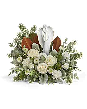 Snowy Grace Bouquet - Radiant and serene, an elegant angel graces a bed of fragrant, snow-white roses and carnations-an inspiring tribute to a life filled with brightness and your unwavering support, bringing a touch of grace to every moment. Experience the serene beauty of white roses, carnations, miniature carnations, and button spray chrysanthemums, complemented by dusty miller, spiral eucalyptus, magnolia leaves, cedar, and Douglas fir. Delivered with the Angel of Grace keepsake, this arrangement embodies timeless elegance. Approximately 19&quot; W x 14&quot; H