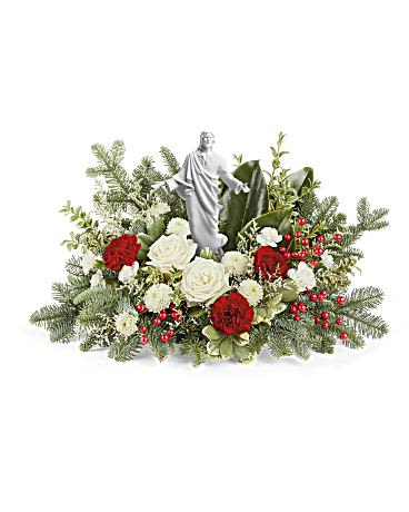 Heavenly Peace Bouquet - Nestled among radiant red and white blooms, the sacred grace keepsake infuses joy and light into your special occasion. White roses, red carnations, white miniature carnations, and white button spray chrysanthemums are complemented by white limonium, variegated pittosporum, magnolia leaves, oregonia, and noble fir. Presented with a Sacred Grace Keepsake, this arrangement epitomizes elegance and reverence. Approximately 21 1/2&quot; W x 13&quot; H