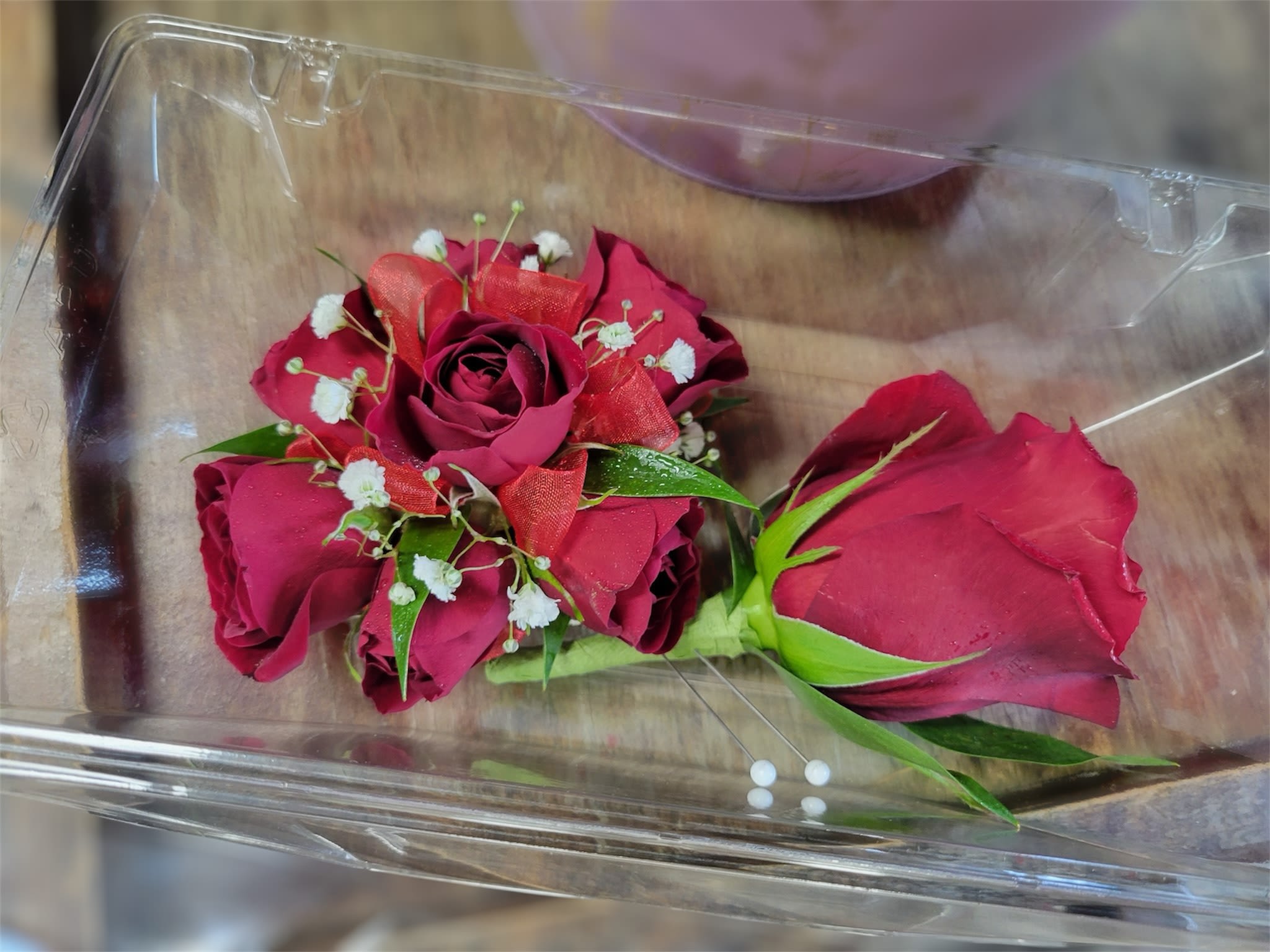 Red Rose Package - The classic red rose boutonniere and red spray rose wrist corsage.