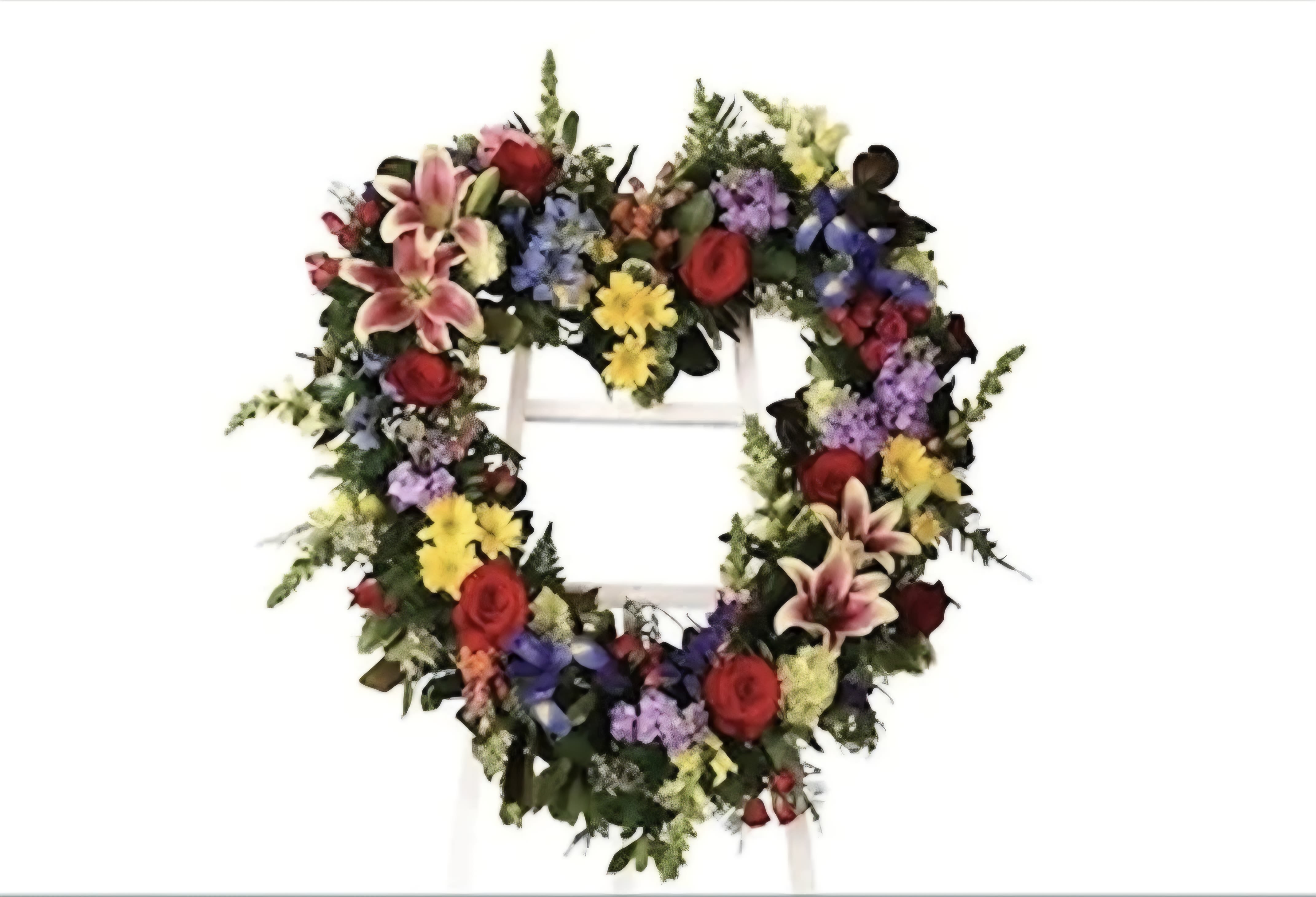 Forever Loved - This heart easel is full of bright vibrant colors and truly lights up the room. This arrangement is elegant and is a classic choice for a loved one.