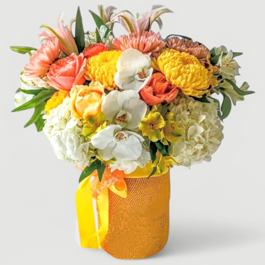 Yellows Beautiful Bouquet Designer's Choice - Beautiful yellow and white bouquet filled with roses orchids hydrangeas lilies and more arranged in a tall modern glass cylinder vase wrapped in pretty yellow jute ribbon. Perfect to send today to show them how much you care. Always made extra special and unique each time. Send them hugs and good vibes.