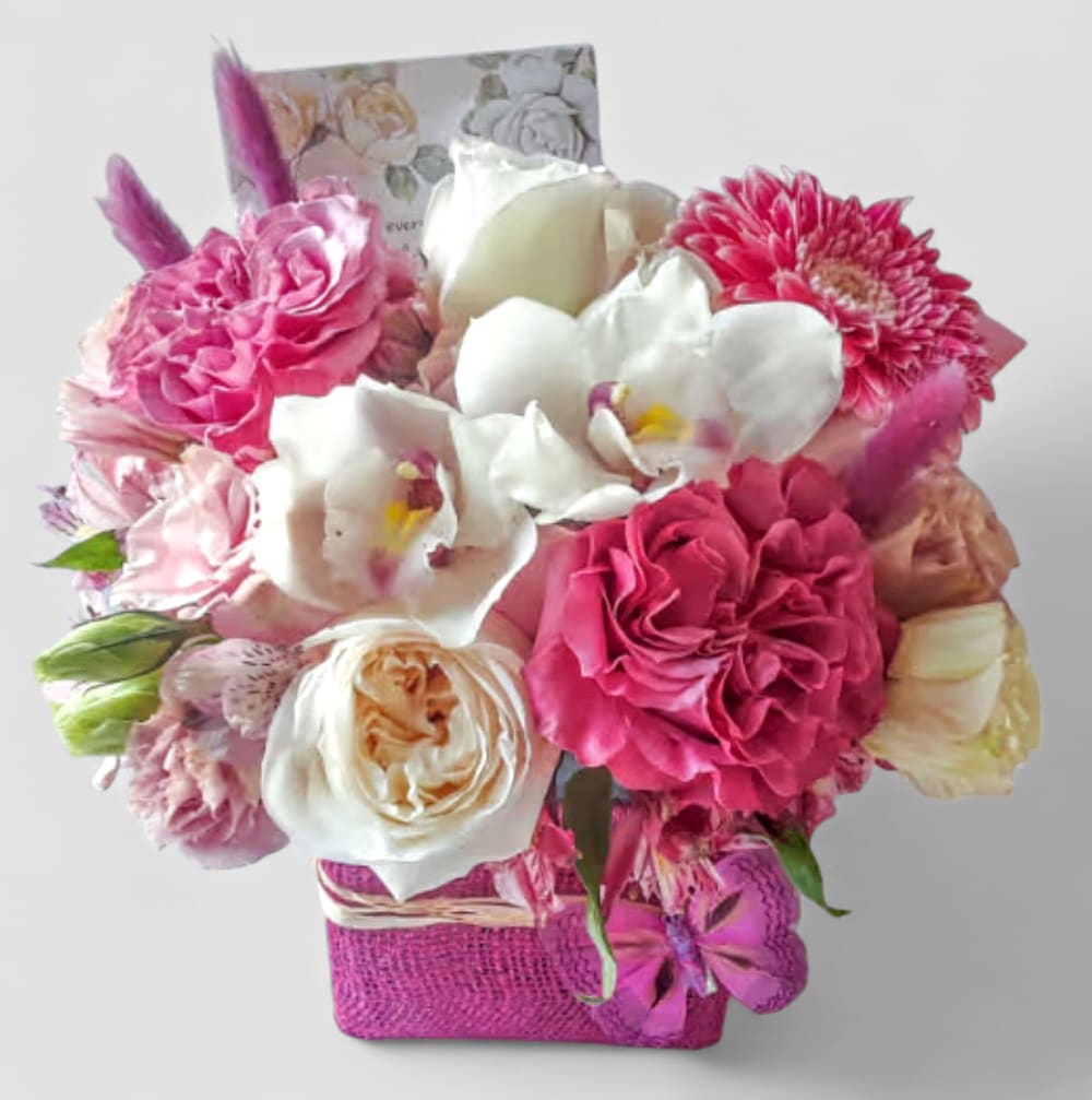 Candy Pink And White Happy Birthday Blossoms Beauty Designer's Choice Candy Pink And White Happy Birthday Blossoms Beauty Designer's Choice - Made unique and different each time from my beautiful pink and white blossom selection of that day roses orchids and more arranged in a modern glass cube vase wrapped in beautiful candy pink jute ribbon. Perfect for a Happy Birthday. All fresh flower bouquets that leave my flower shop studio are beautiful works of art made special each time. Send them happiness.