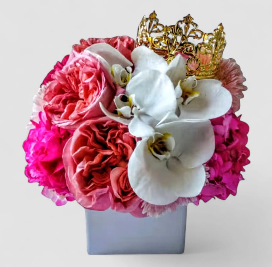 Pink Beauty Bouquet Designer's Choice - Send this pretty beauty today to show them how much you care with it's beautiful pink roses vanilla hydrangea and orchids arranged in a beautiful white modern glass vase adorned with a gold crown. Perfect to send for every occasion to make them smile. All bouquets that I design are always made extra special each and every time. Send happiness. 