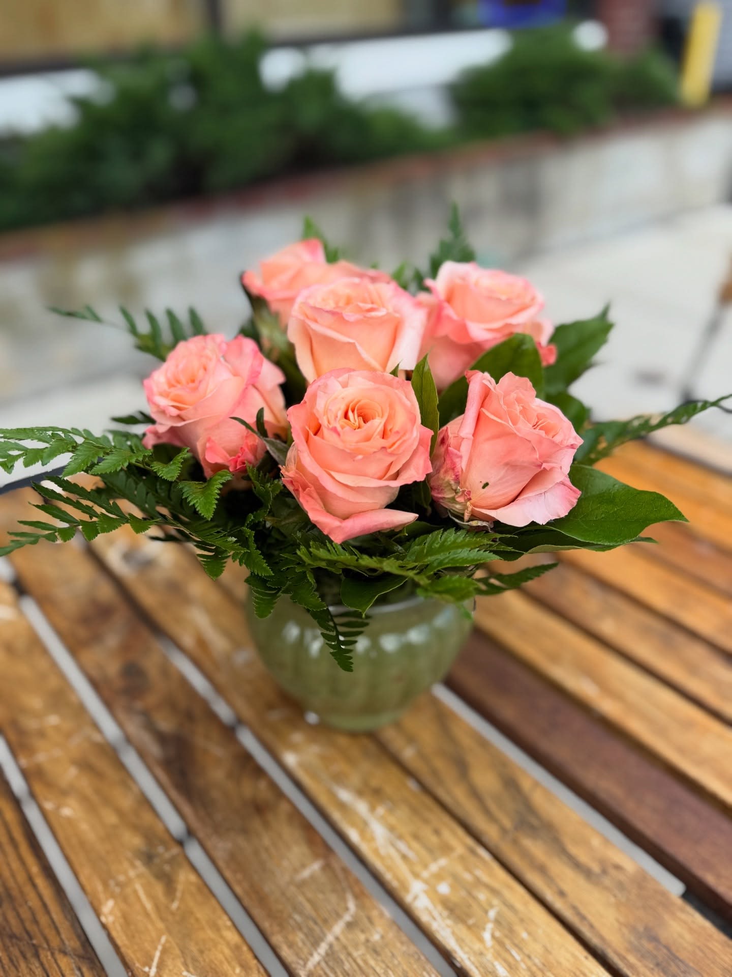 Sweet Shimmer Rose Bouquet - We arrange 6 peachy pinky shimmer roses with foliage. Containers vary based on our inventory. Our roses are fresh and long lasting. This is a pick up only item. 