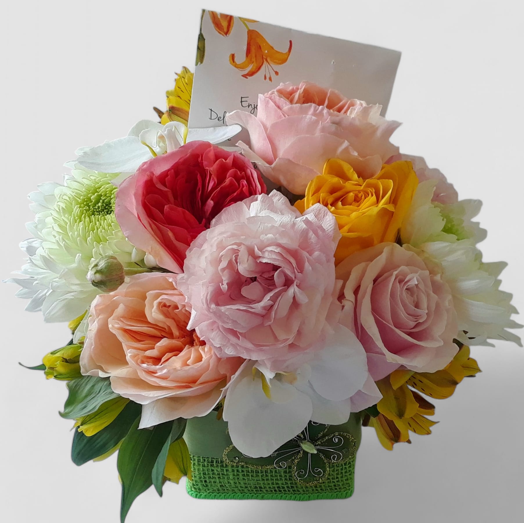 Best Friend Blossoms Beauty Designer's Choice Best Friend Blossoms Beauty Designer's Choice - Pastel blossoms of that day roses orchids and more arranged in a modern glass cube vase wrapped in citrus jute ribbon. Perfect to send today to let you know that you care. Always made extra special and unique each time. Send happiness.