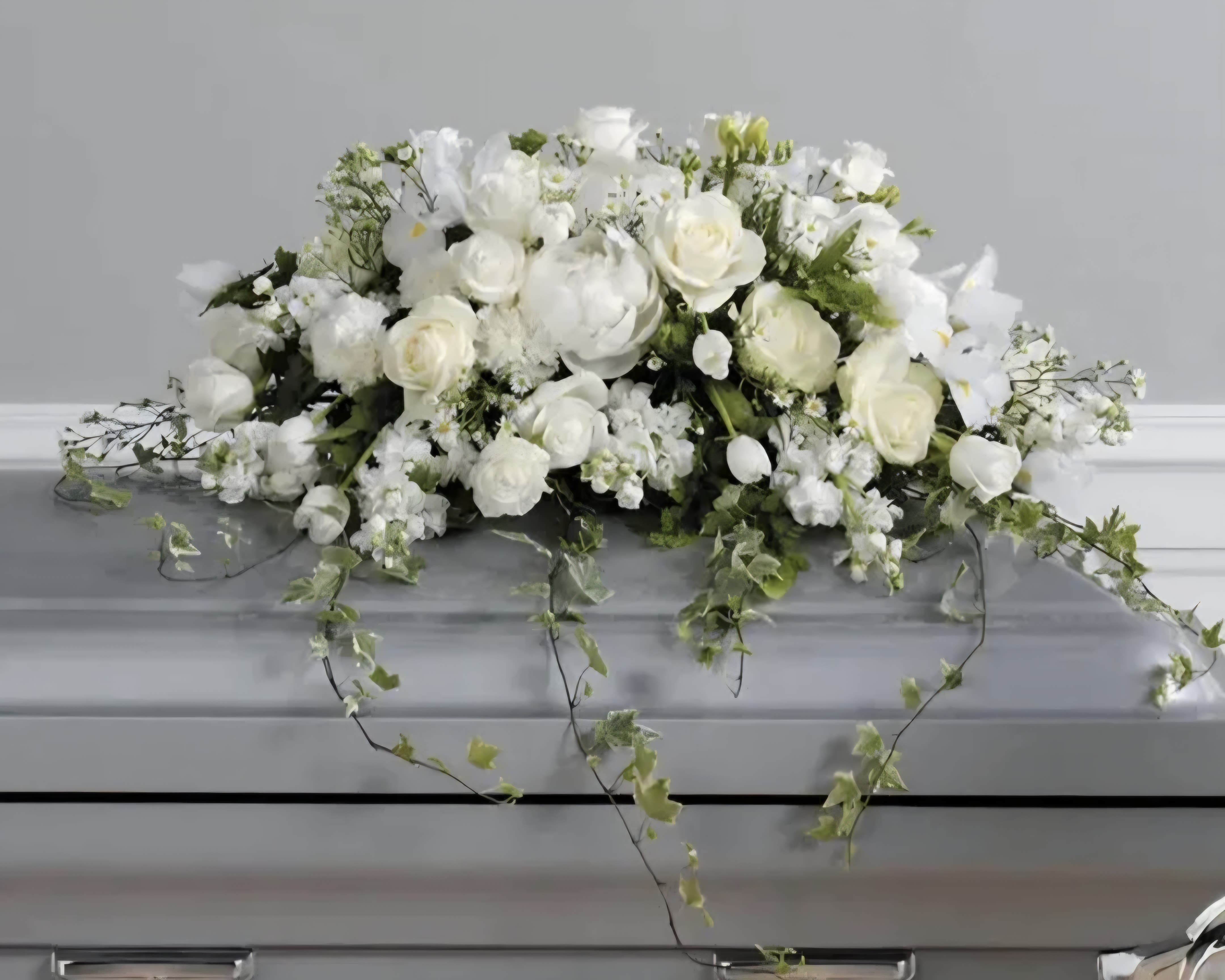 Classic White Sympathy - This elegant all white casket spray adds to any funeral.