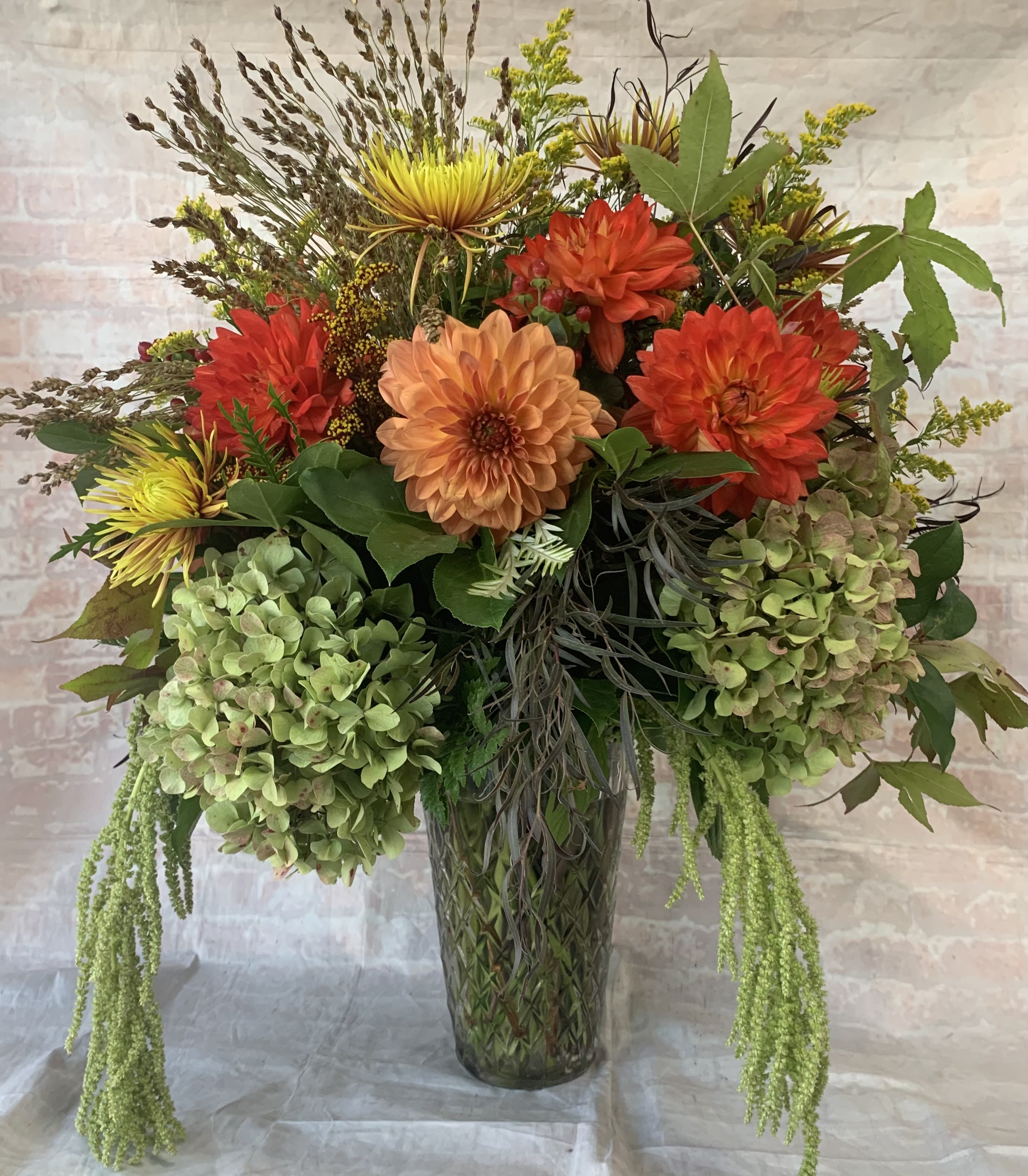 Mango Sorbet Mango Sorbet - Select this extravagant fall arrangement. Flowers include hydrangea, dahlias, hanging amaranthus, cremones, and more!