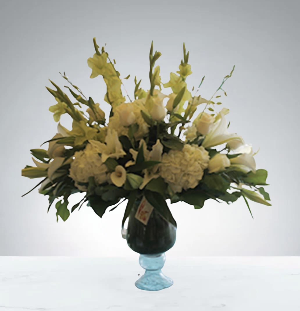 Flower Cloud by D'Lily's Flowers Flower Cloud by D'Lily's Flowers - A mix of white flowers with a very elegant look. Perfect for any accasion.