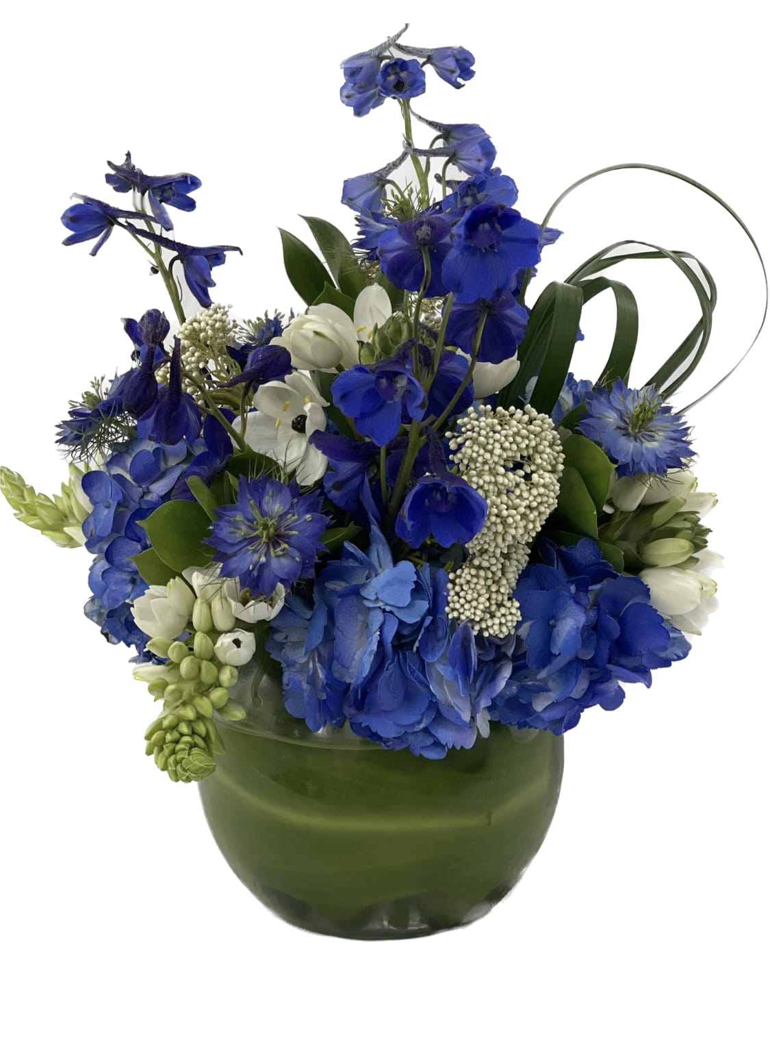 Breeze by the Sea Breeze by the Sea - This blue and white arrangement is the perfect centerpiece! It will compliment any room without taking up too much space. Approximately 14" tall by 12" wide and 9" deep.