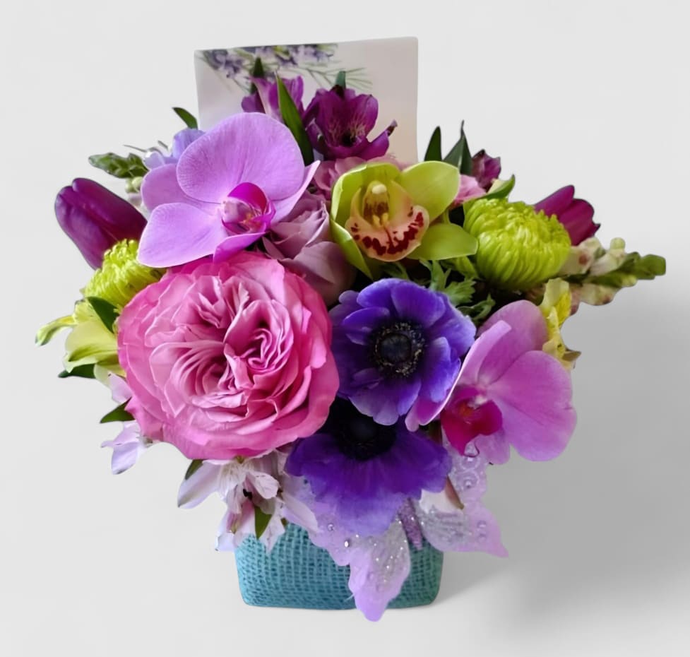 Sending Happiness Bouquet Designer's Choice - Designer's choice; made beautifully from my beautiful blue lavender and mint blossom selection of the day roses orchids hydrangeas and more arranged in a modern glass cube style vase wrapped in pretty soft blue jute ribbon. Beautiful and perfect to send today to make them smile. Always made extra special and unique each and every time. Send them happiness. Send them beautiful.