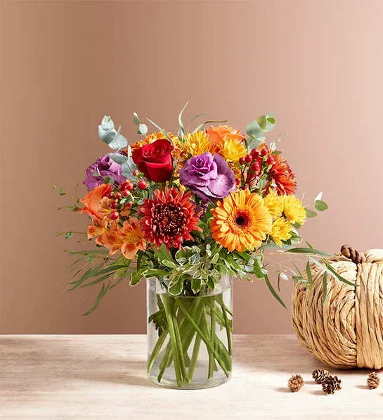 Garden of Grandeur for Fall - We’ve taken one of our best-selling bouquet designs and filled it with all the rich colors and textures of fall. An abundant, garden-inspired mix of blooms is gathered with natural accents inside a clear glass vase. It’s a gift guaranteed to make a grand impression at every gathering.