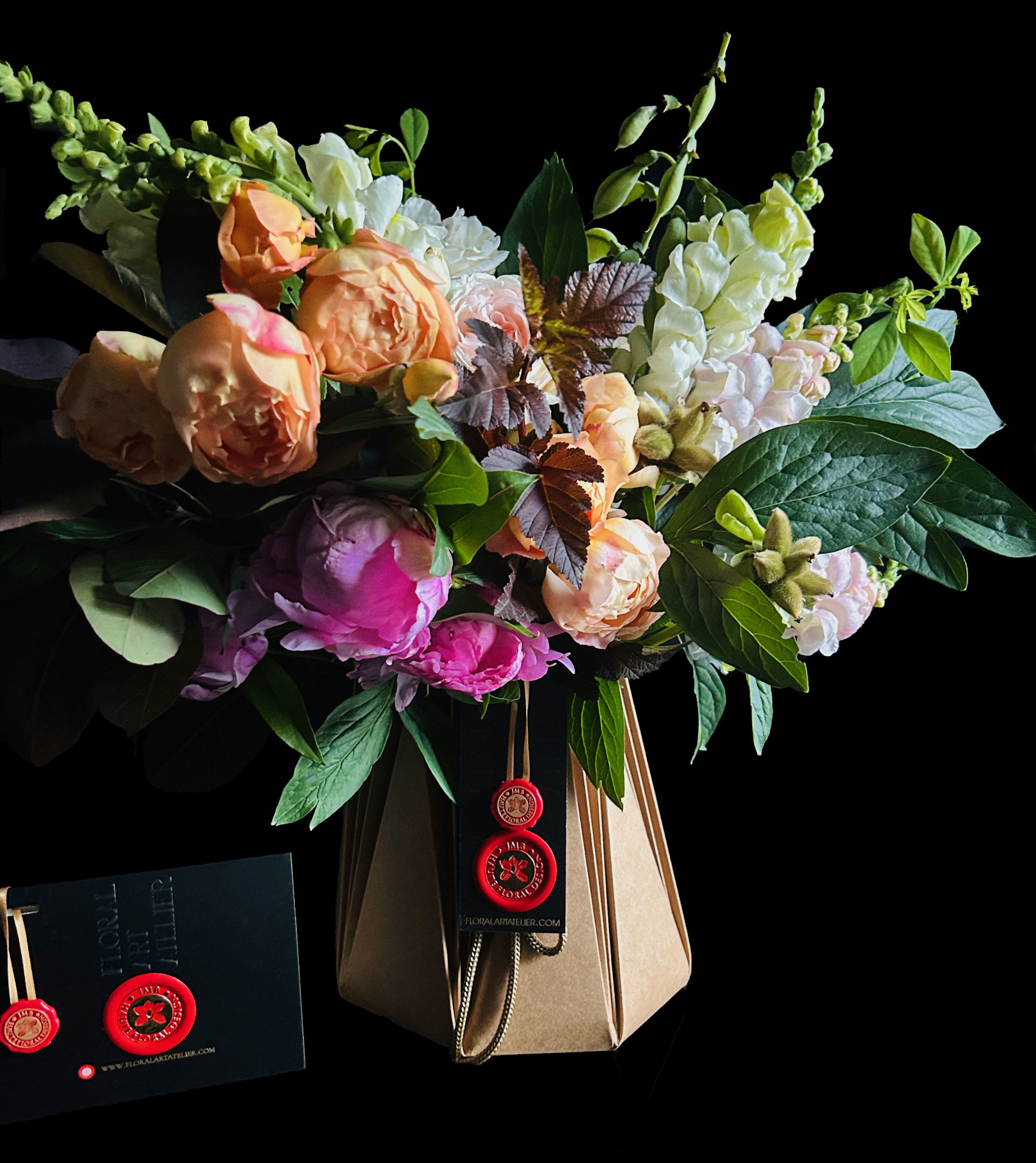 Hand tied Bouquet Moody  - Hand tied bouquet in moody tones with seasonal flowers,, delivered in water tight paper container as pictured.