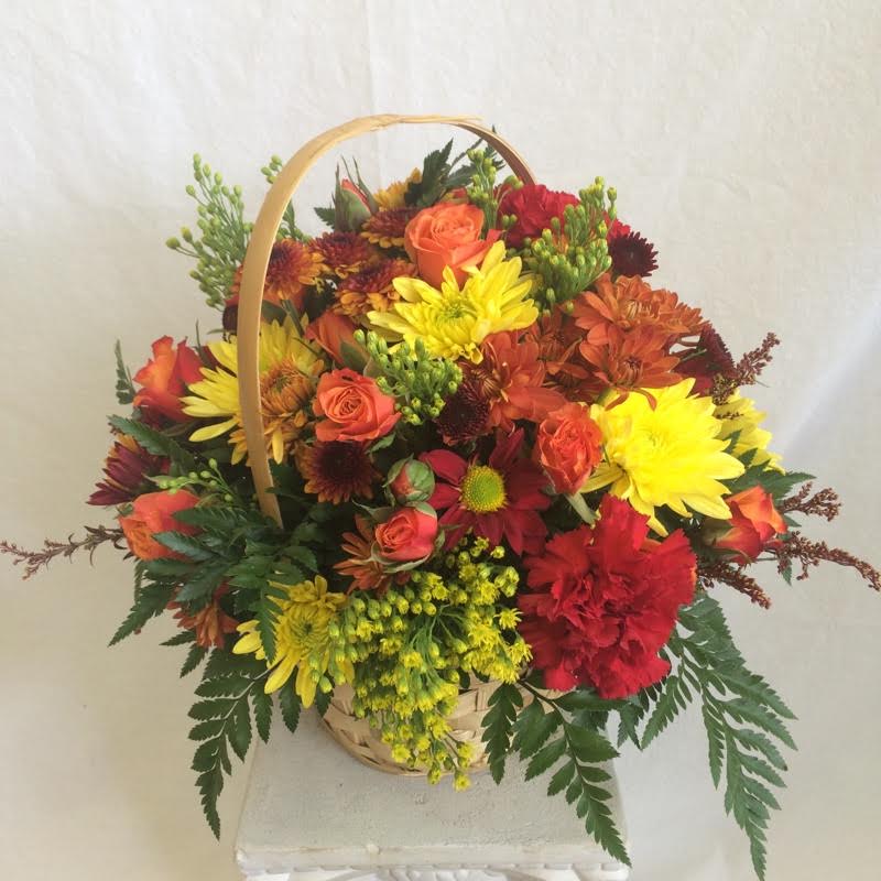 Fall Basket Fall Basket - We’ve filled a rustic handled basket with a gathering of blooms that beautifully capture the season’s brilliant landscape. While right now due to COVID-19 we cannot guarantee a specific flower type, we always ensure your arrangement is beautiful & fresh arranged in a variety of colors