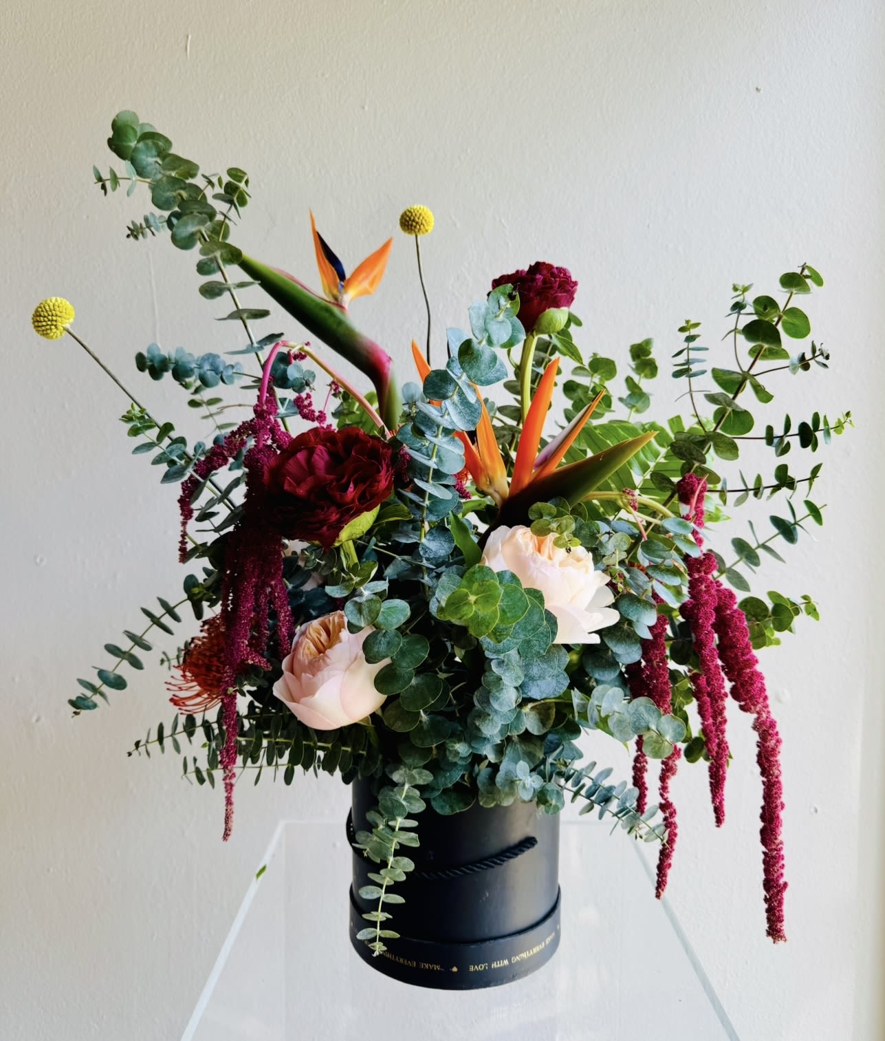 Fragrant Beauty - Fragrant eucalyptus in a modern design with tropical birds of Paradise, Pincushions, Garden Roses, Craspedia and Peonies - upon availability ( If not available will be substituted with a flowers of the same value like Orchids or Garden Roses