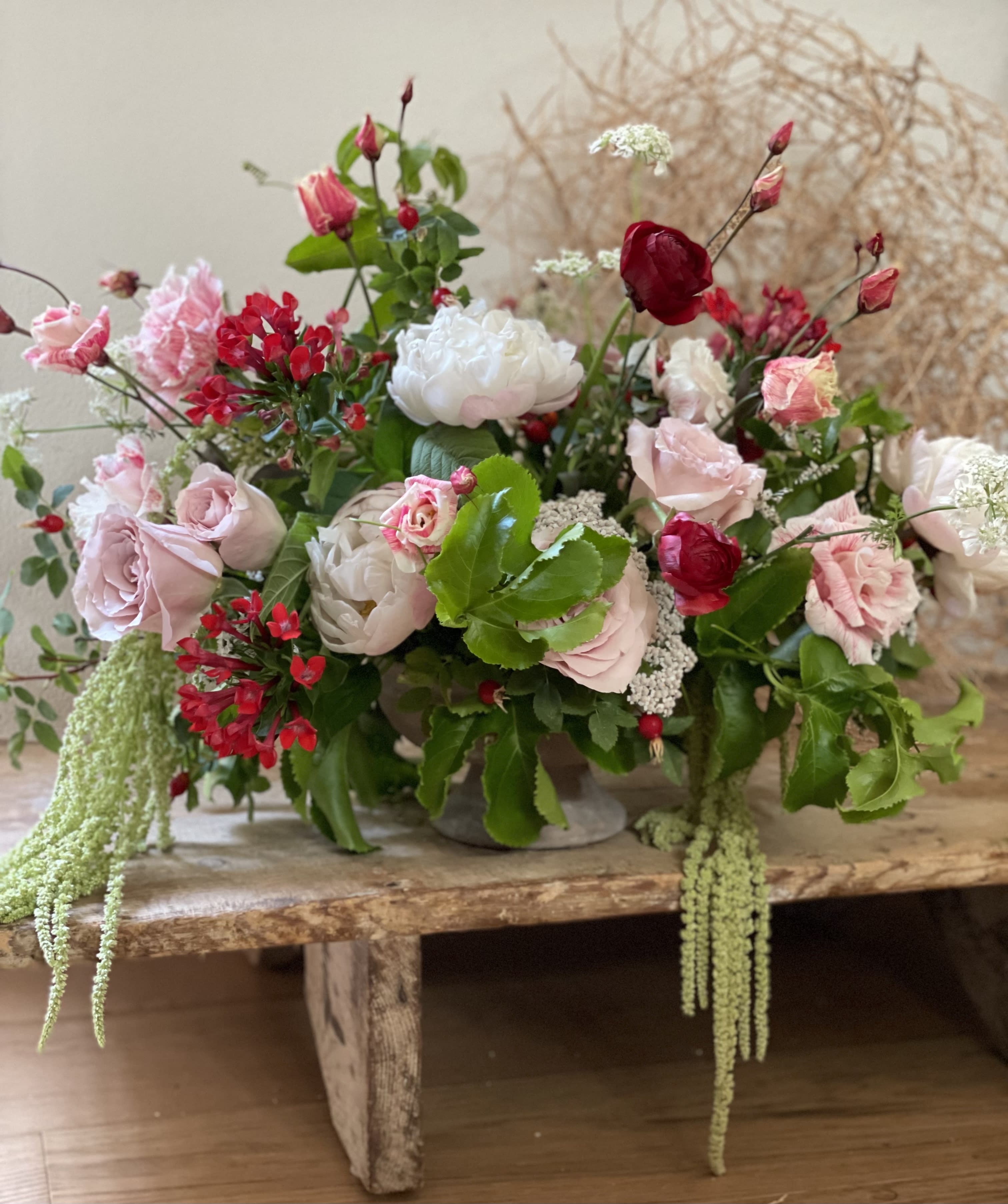 The Grand Luxe - The Grand Luxe - Where flowers meet spectacle.    This statement-making arrangement overflows with premium blooms, lush greenery, and artful design, creating an unforgettable centerpiece. Designed to impress, it features the season's most extraordinary flowers arranged with elegance, drama, and scale. Perfect for milestone celebrations, lavish gatherings or as the ultimate gift. *Photos shown are examples only; each creation is uniquely yours. **Please allow three days' so we can source the freshest flowers for your design. 
