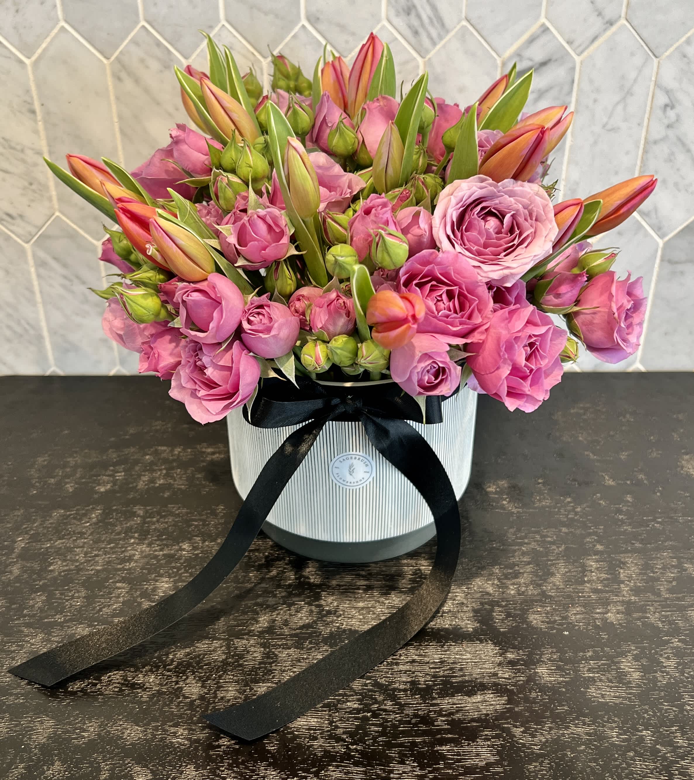 Tulips & Spray Roses Tulips & Spray Roses - Tulips and spray roses in a ceramic or glass vase depending on availability. Other colors available. Please ask.