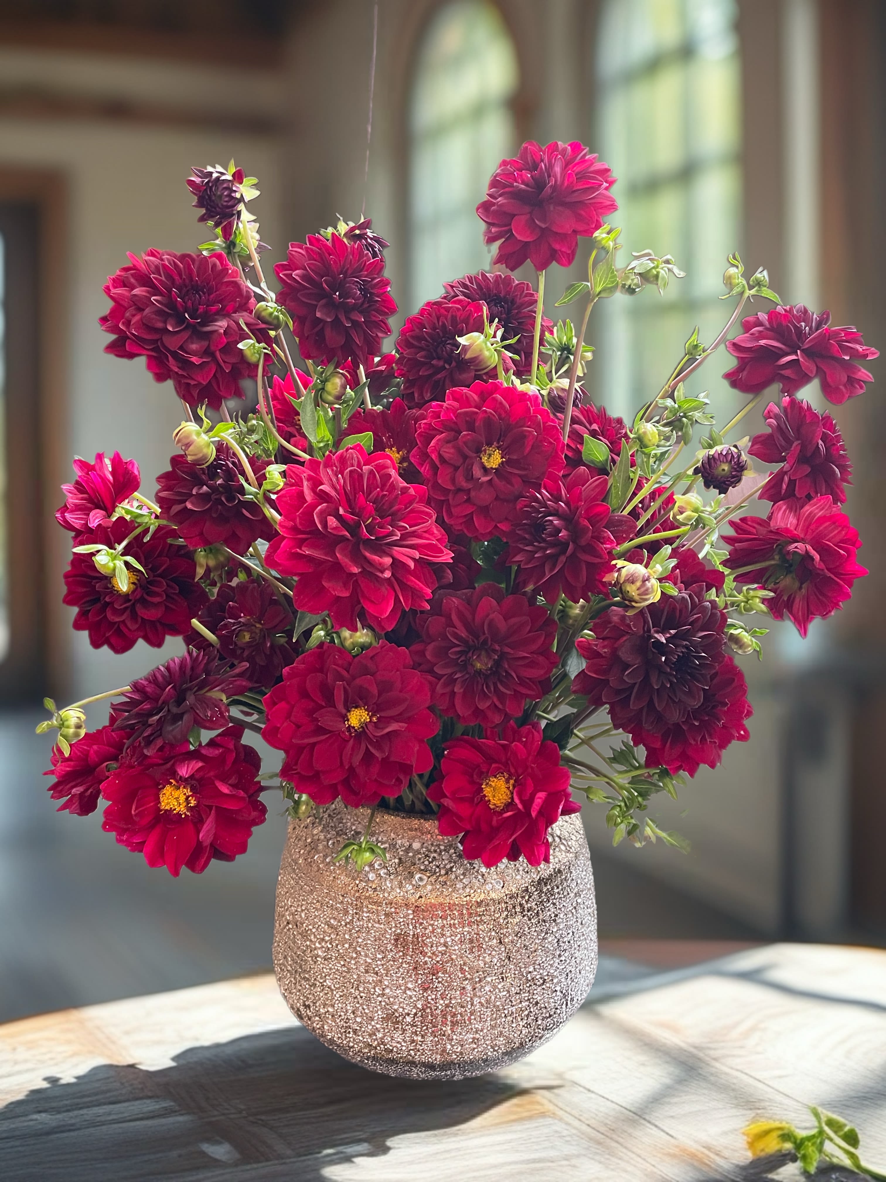 Passion red  - This captivating arrangement features deep red dahlias, embodying passion and deep admiration. If dahlias are unavailable, beautiful grand deep red roses, peonies, or orchids will be used to maintain the same striking aesthetic. The bold, velvety blooms are artfully arranged together, creating a mono composition that draws the eye and evokes strong emotions. Perfect for expressing heartfelt sentiments, this stunning display radiates warmth and intensity, making it an ideal centerpiece for any occasion.