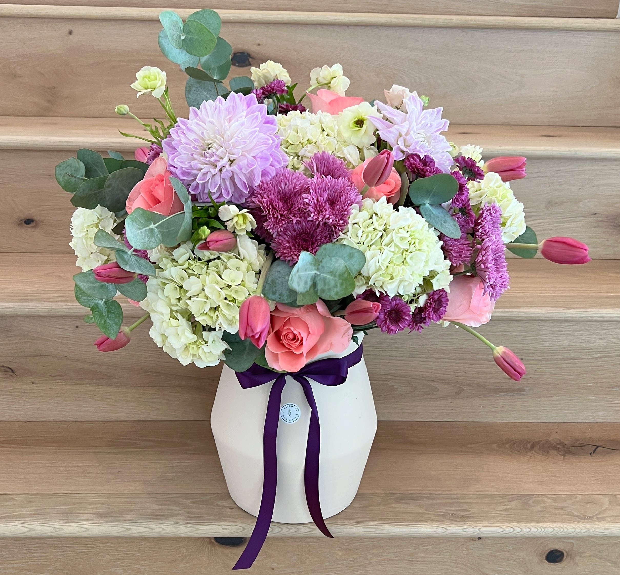 Grand arrangement! Grand arrangement! - If you are looking to wow someone this arrangement will do just that. A mix of premium flowers in a ceramic or glass vase depending on availability.