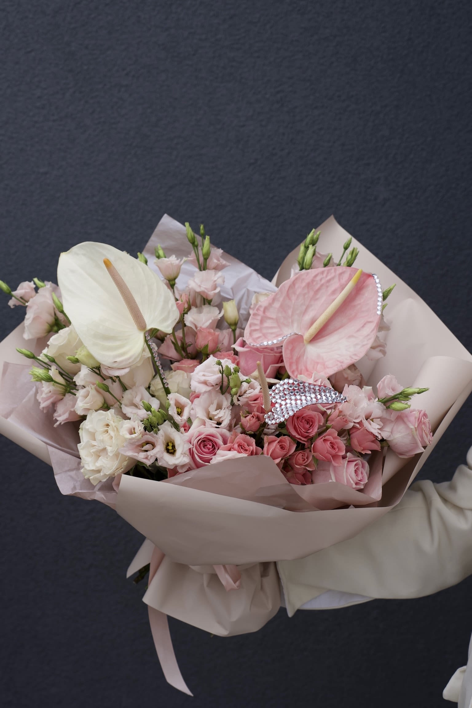 Crystal Bloom - A couture bouquet designed as a statement piece. Soft pink shades layered with unique textures make this arrangement a perfect balance of delicacy and strength.