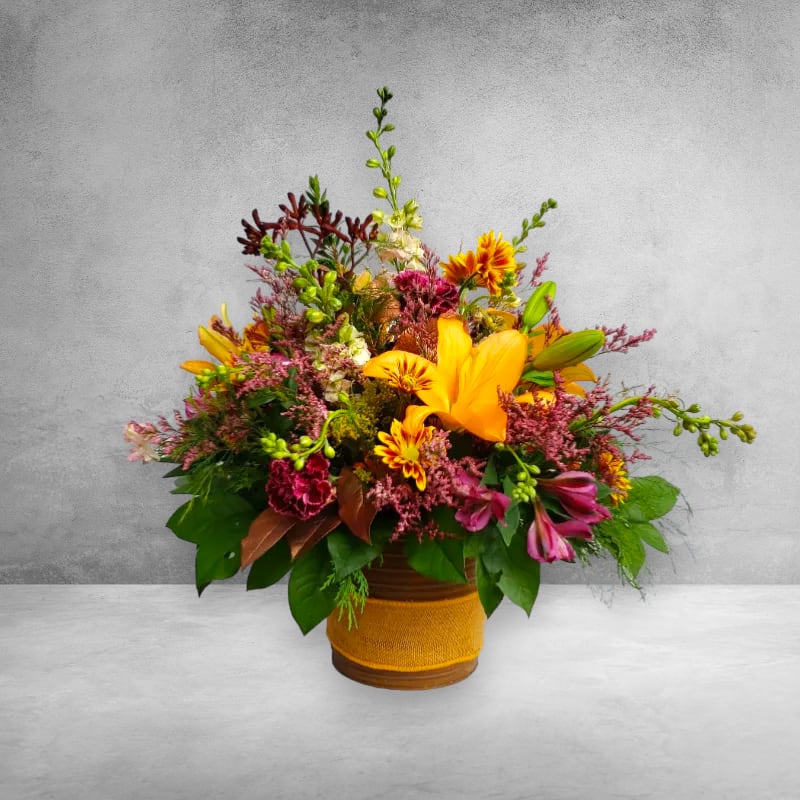 Fall Harvest Flower Arrangement Fall Harvest Flower Arrangement - Some of the most exciting parts of fall are the signs of the changing season, fall is one of the seasons that has vibrant shades found outdoors. Fall is the season where the outdoors nature comes to life inside. “Fall Harvest” is truly a thankful celebration this Thanksgiving holiday. Giving flowers on Thanksgiving do two simple things, first the flowers decorate your Thanksgiving table with lush Autumn colors and it finishes the table. Second, the flowers give thanks to the host for all the hard work preparing the meal. In our “Fall Harvest” this season, we have a beautiful selection of lilies, alstroemeria, larkspur, and daisy. Flower availability this season is still crazy but with our design techniques and years of experience, we are going to create fabulous bouquets. However, please take note that variations might happen with the flowers. We do have some suggestions for you while you order flowers this season. Order as early as possible, timing and availability is going to be everything this season. Another concern is not having a recipient phone number, we do not phone ahead before we deliver but sometimes the recipient lives in a gated community. If we don’t have the proper contact information it can delay us getting the flowers to your friends and family. Specialty Floral Design is a local florist and we will be doing flower deliveries throughout the Olympia, Wa area. Happy Thanksgiving and we are excited to start our holiday magic.