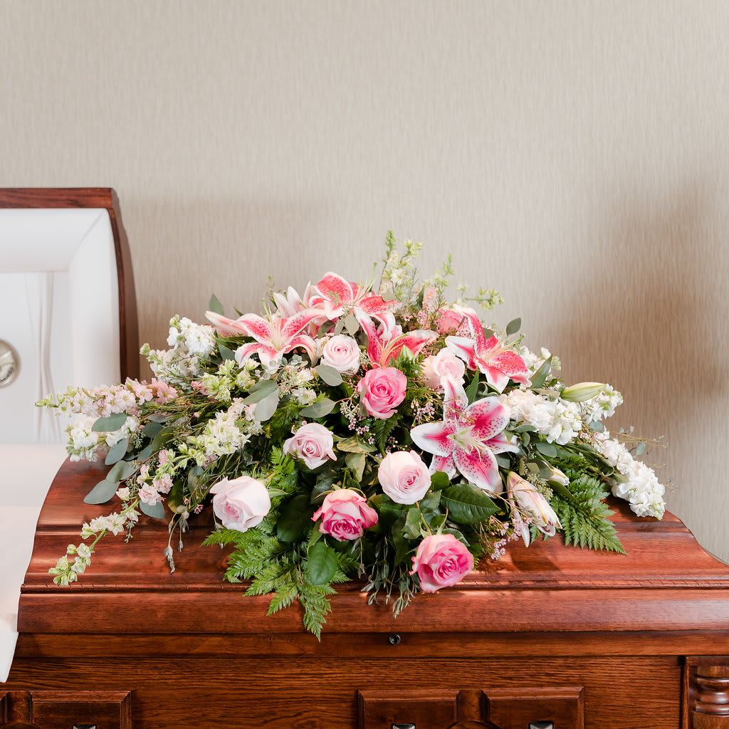 Faith  - A soft blanket of delicate pinks and whites to lay upon your loved one's casket. 