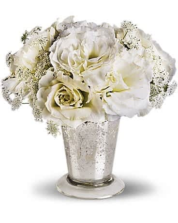 Teleflora's Angel Centerpiece Teleflora's Angel Centerpiece - A petite expression of elegance, this angelic centerpiece pairs airy Queen Anne's lace with delicate lisianthus in an antiqued Mercury Glass Vase. A Mercury Glass Antique Vase holds Queen Anne's lace and lisianthus.