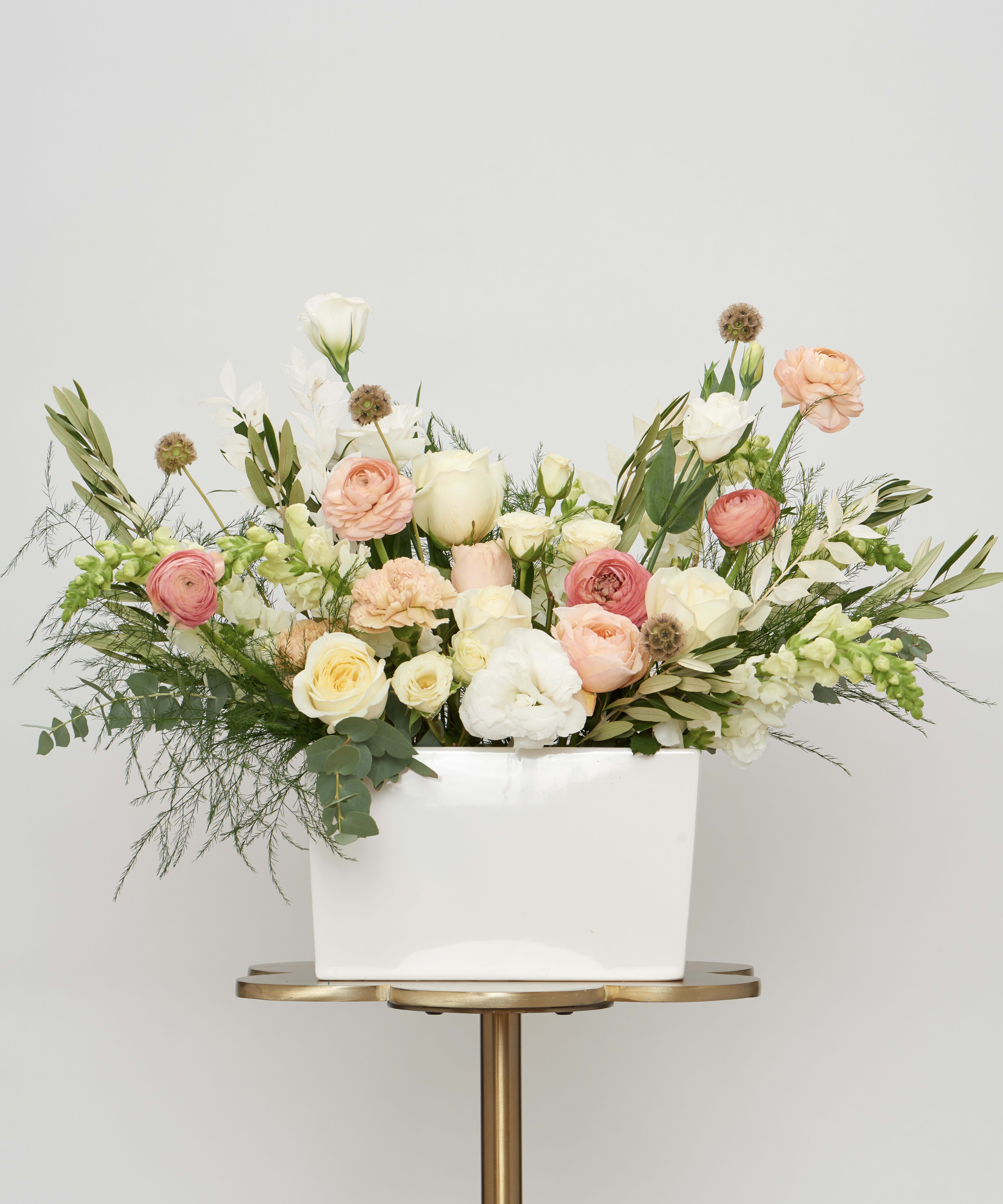 Hello Lovely - A full, premium arrangement of soft pinks, whites, and fresh greens. Designed for grand gestures and special occasions. 