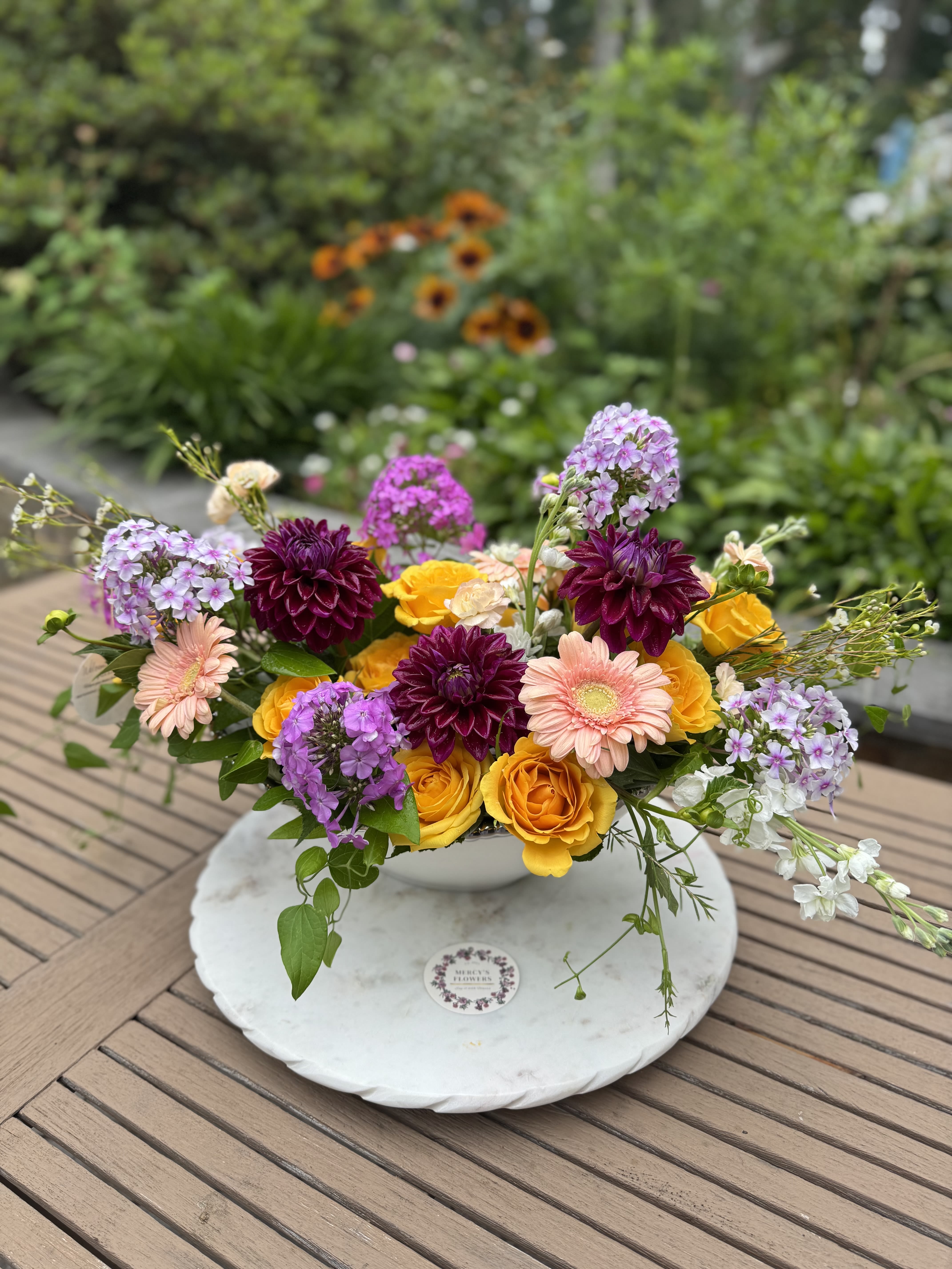 The Alexandria Bouquet - A hand-crafted bouquet made with local love-featuring Phlox, California wax, Stocks, Yellow roses, and Dahlias. With a sweet summer fragrance. 