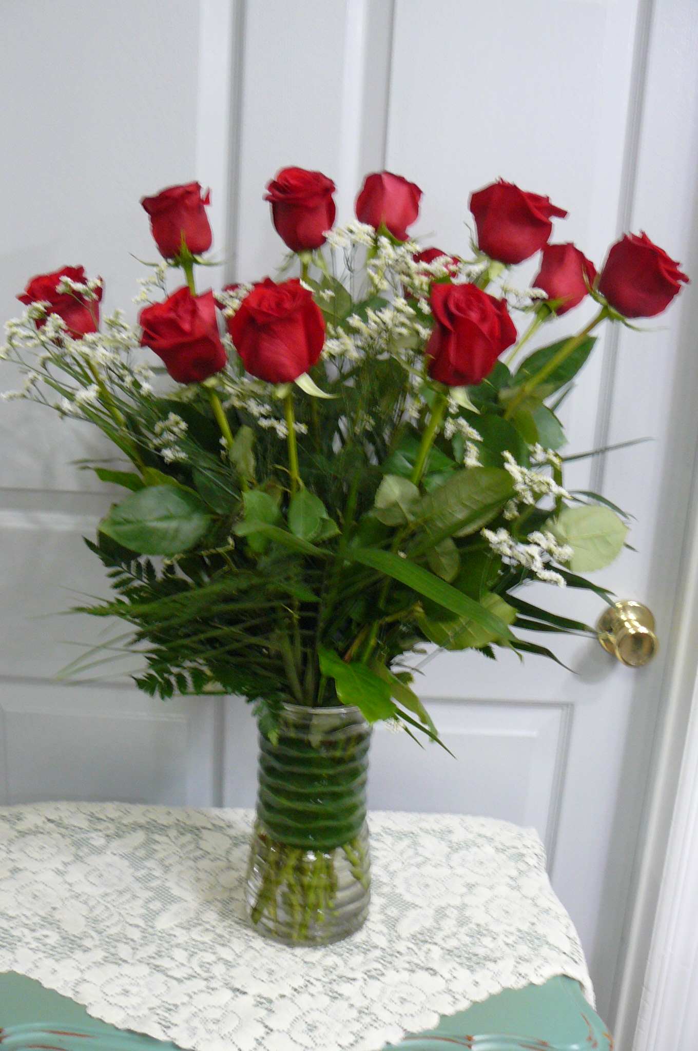 Blooms Long Stem Premium Red Roses - Premium Long Stem Red Roses with Fancy Greens in a Tall Vase.  Call For Rose Color Choices.