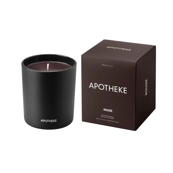 Apotheke Charcoal Rouge Classic Candle - Charcoal Rouge combines velvety damask rose, crushed geranium leaf bathed in spicy elemi resin with hints of lemon and infused with the smoky and earthy essence of burning birch to create an intoxicating and romantic fragrance.  Made with a premium soy wax blend and essential and perfume-grade fragrance oils, this luxury scented candle is designed to provide a clean-burning and exceptional scent experience. All Charcoal Rouge Scented Candles feature its signature rouge hued wax.  The black glass vessel with its luxurious matte finish offers a modern and timeless look fit for any decor.  Made in the USA