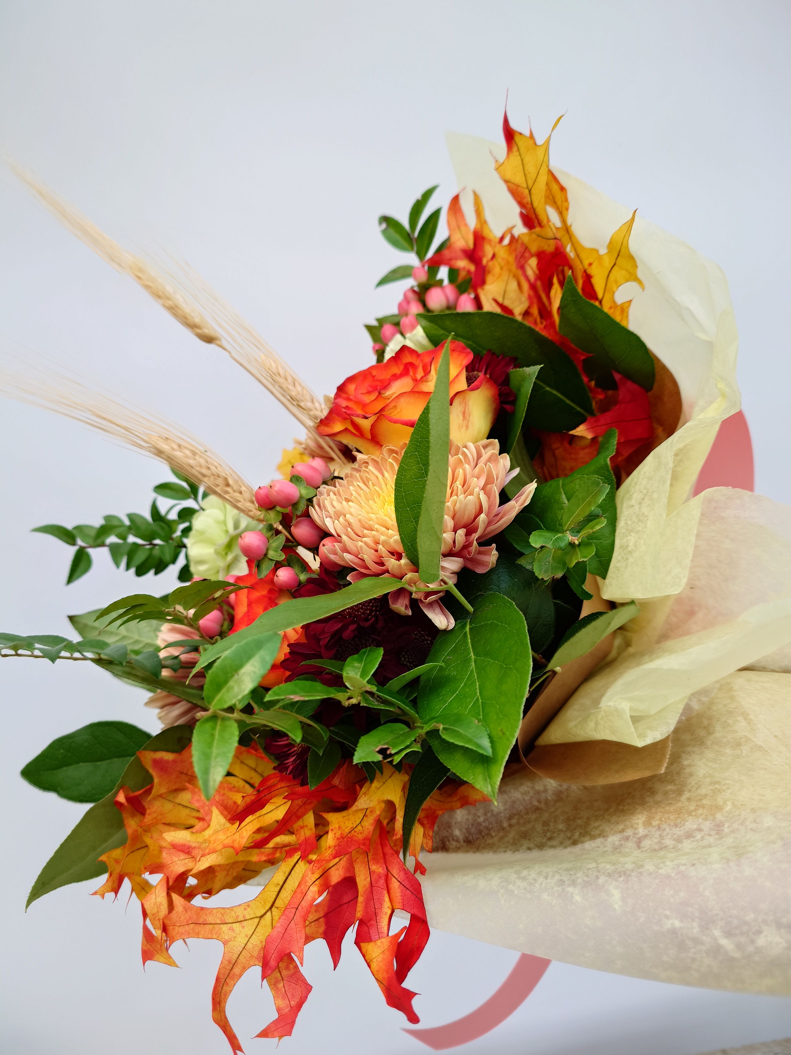 Fall Wrapped Bouquet - A stunning collection of autumn flowers, thoughtfully arranged for you to showcase in your favorite vase, bringing the warmth and beauty of fall into your home.