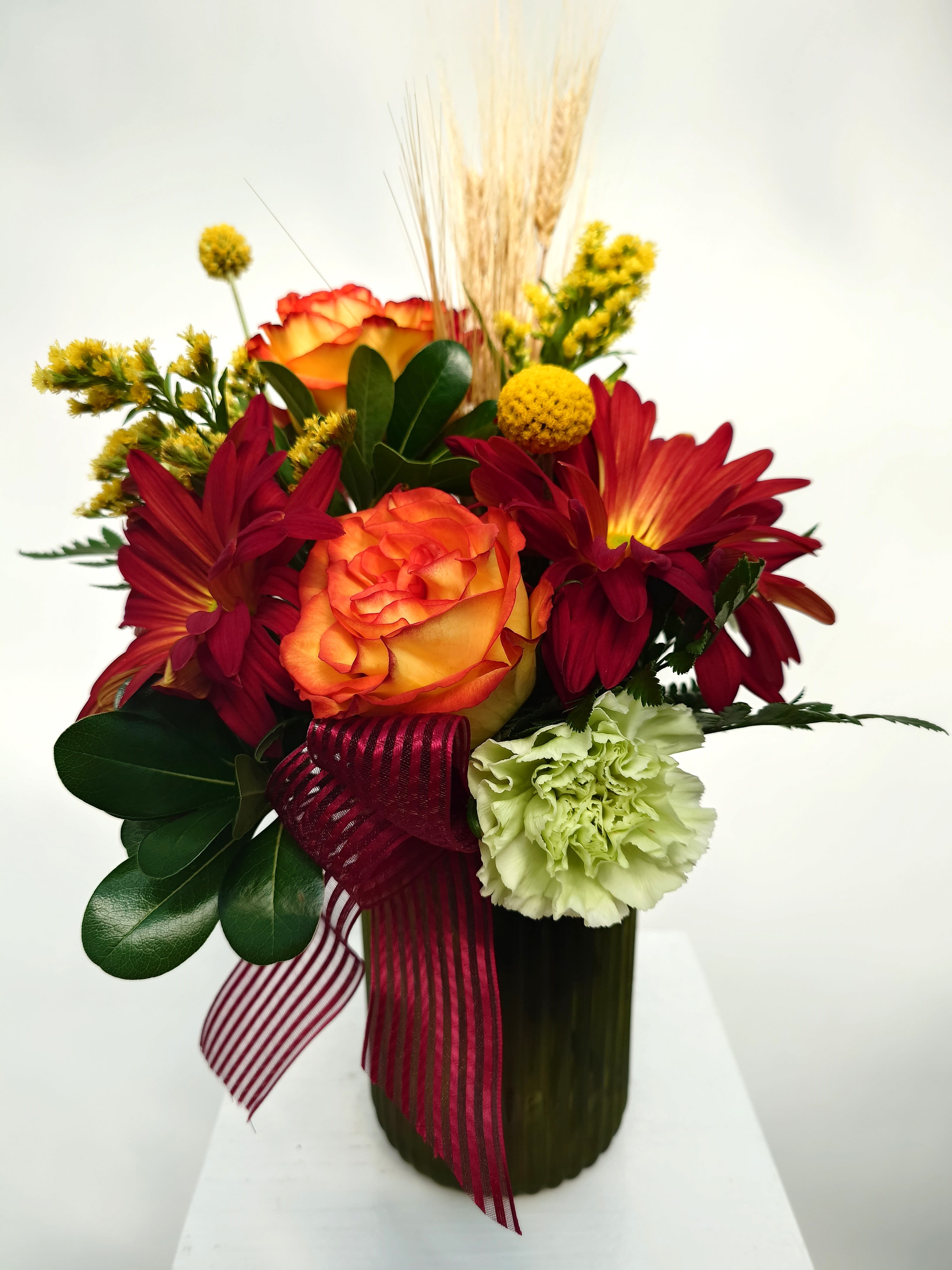 Hayride - The &quot;Hayride&quot; arrangement captures the essence of autumn with a vibrant blend of rustic flowers, warm-hued roses, and touches of yellow, evoking the cozy charm of a countryside hayride.