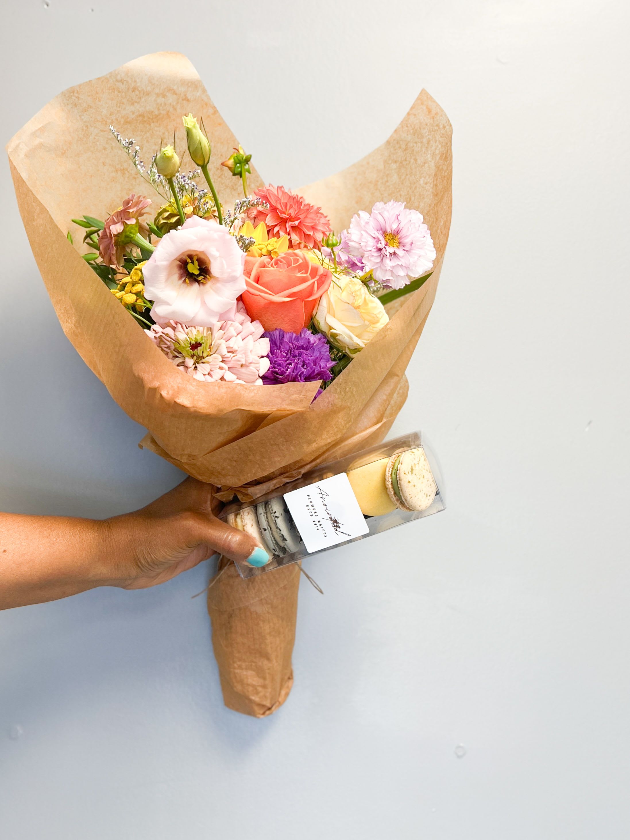 Sweet Blooms &amp; Bites Bundle (No Vase) - Give the gift of color and indulgence with our Sweet Blooms &amp; Bites Bundle. This joyful set includes a handcrafted bundle of fresh, locally grown flowers — bursting with color and charm — paired with a gourmet box of French macarons. USDA-certified organic, natural ingredients, gluten-free, and made with real ingredients (no dyes or preservatives).  Perfect for birthdays, client gifts, or a thoughtful surprise! 	•	Flower bundle made with local and farm-fresh seasonal blooms 	•	Macaron box includes assorted flavors (6-count) 	•	Available for pickup or local delivery 