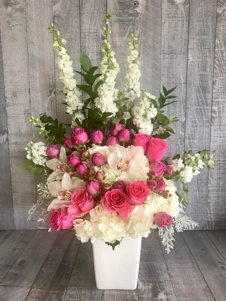 Pink For You Pink For You - A mix of fresh flowers including tulips, hydrangea, mini roses, orchids and more. Container may vary