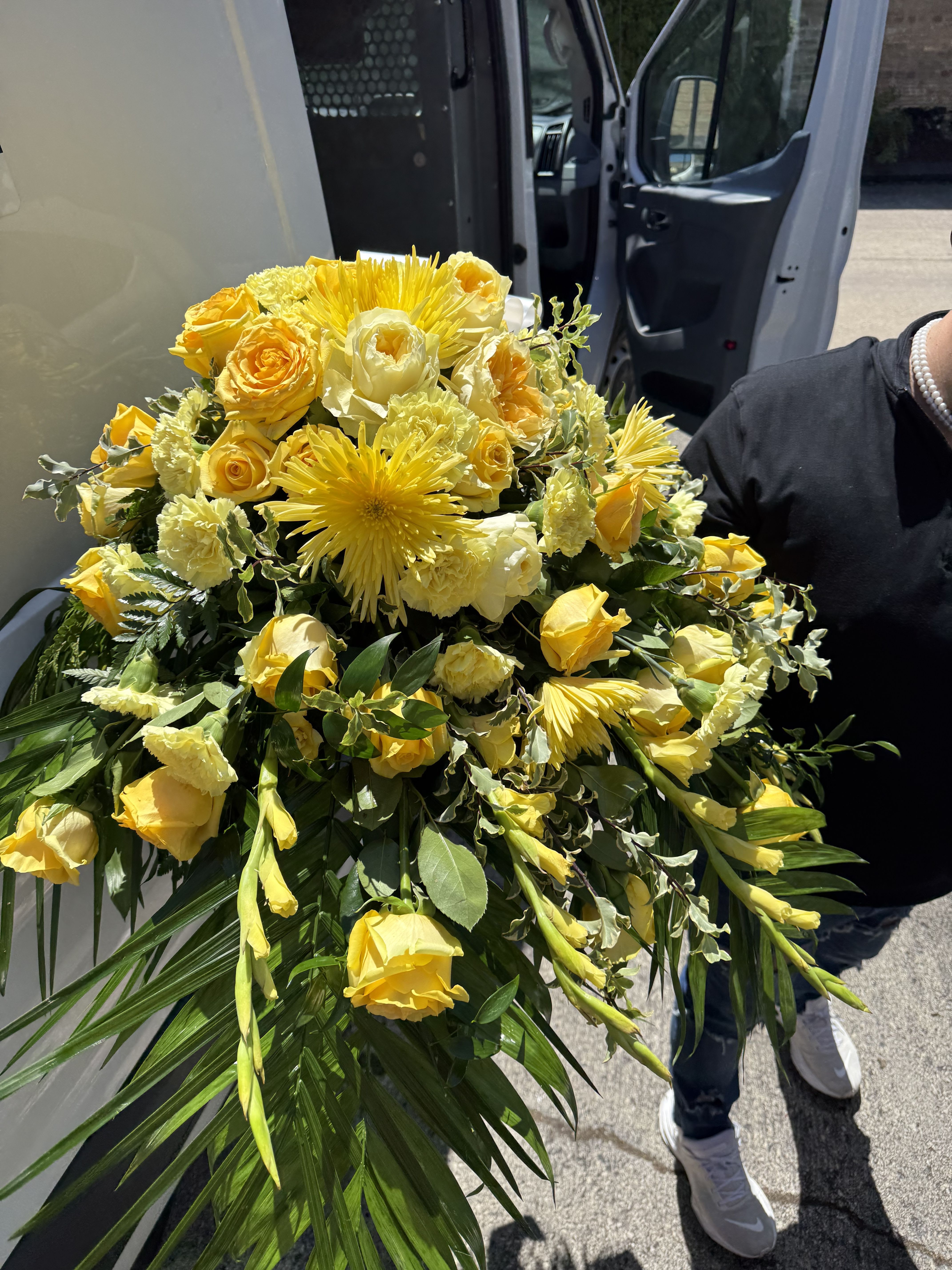 Yellow Yolk Sunrise Casket Spray Yellow Yolk Sunrise Casket Spray - Yellow roses, yellow yolk roses, yellow mums in this beautifully made casket arrangement