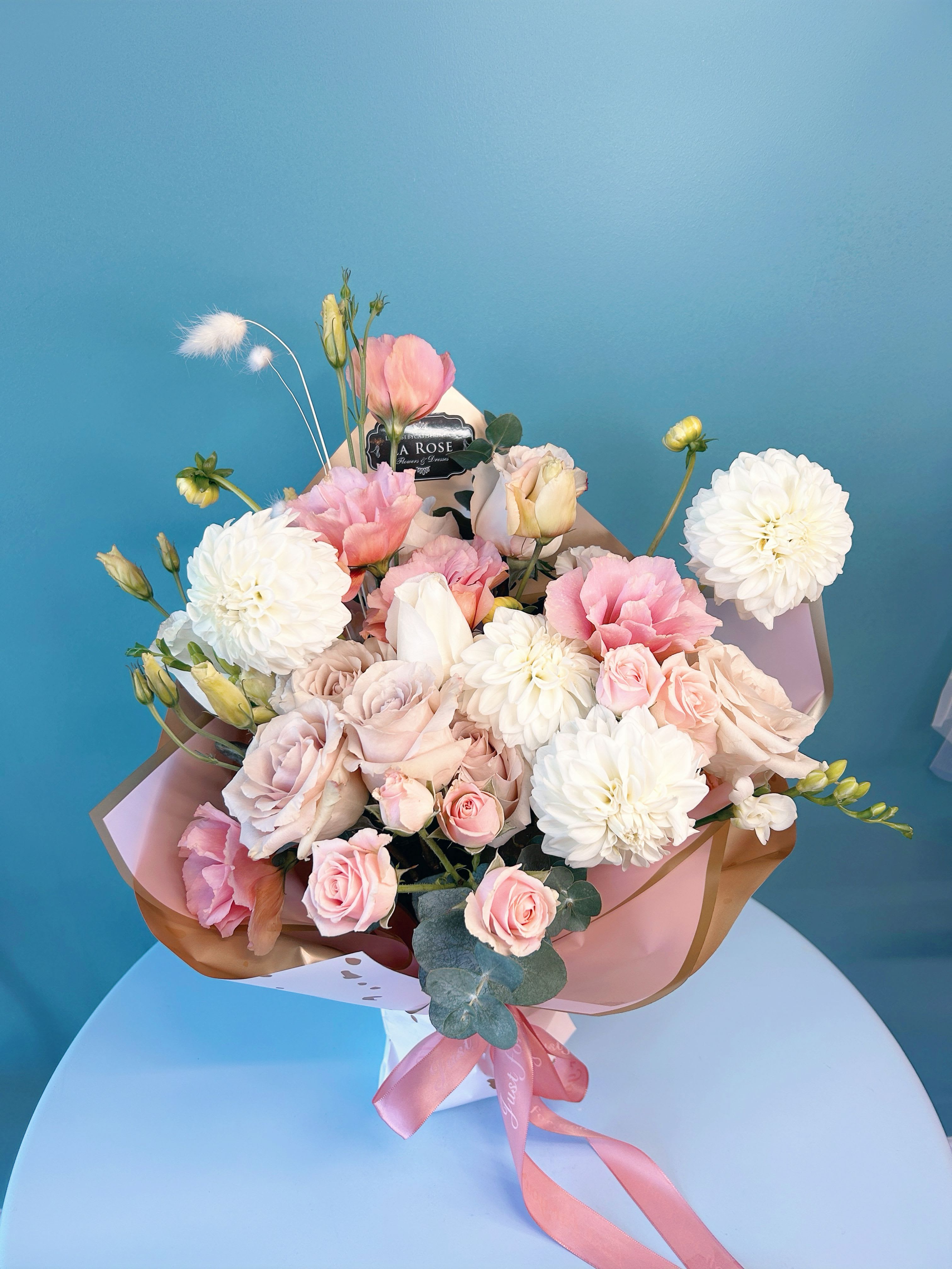 Blush Vase Bouquet - Featuring premium seasonal fresh blooms and foliage, arranged in a modern and artistic design, at the choice of your colour preference, all wrapped with designer's paper and packaging  standard size:  14-16 florals deluxe size:  20-22 florals premium size:  26-28 florals  Leave us a note at the check out for your preferred colour theme and floral variety. It is NOT guaranteed that your final order will match what you requested but we will do our best to design accordingly.