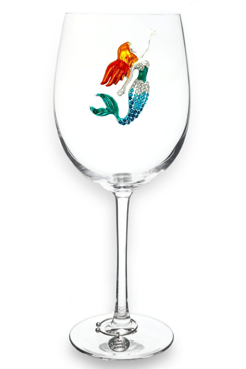 Jeweled Mermaid Wine Glass Jeweled Mermaid Wine Glass - The most popular jeweled wine glass adorned with a beautiful red headed mermaid jewel. Celebrate all things summer with a gorgeous glass.