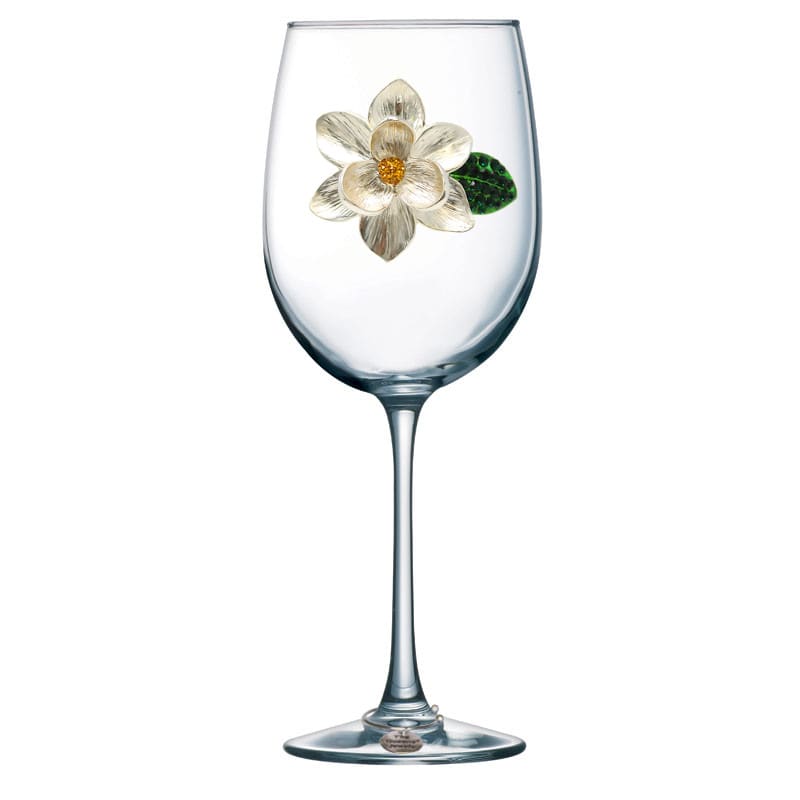 Magnolia Jeweled Glassware Magnolia Jeweled Glassware - A Stemmed wine glass adorned with a beautiful magnolia by Queens Jewels.