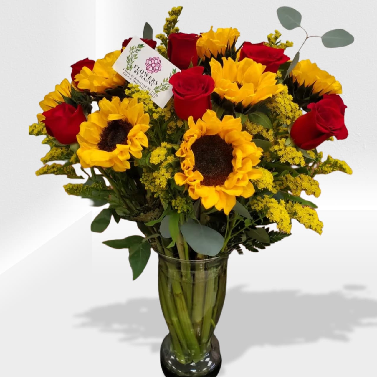 Overnight arrangement - Overnight arrangement is a nice combination of 12 roses, 12 Sunflowers 6 solidago In vase 