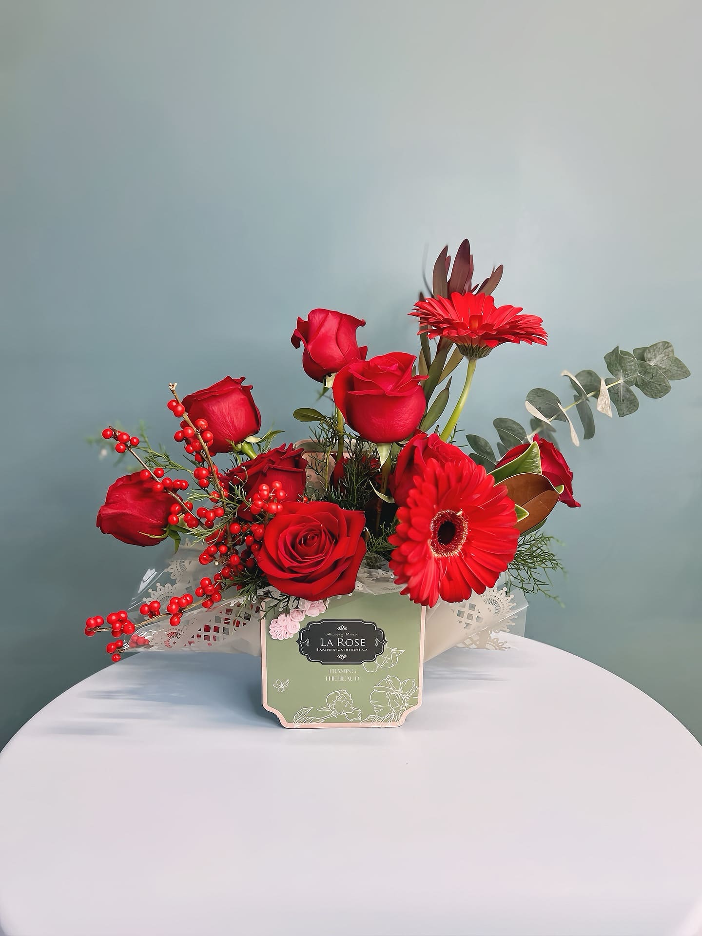 Winter Flower Box - Celebrate the beauty of the season with our Winter Flower Box, featuring a stunning mix of winter blooms and rich, seasonal foliage. Designed to capture the essence of winter, this arrangement includes flowers such as roses, amaryllis, and evergreens, all thoughtfully arranged in a stylish luxury box. Perfect for holiday gifting, home décor, or winter weddings, each flower box is beautifully packaged for an elegant presentation. Add a touch of winter magic to any space with our premium, seasonal floral arrangement.   standard size : 14-16stems of florals deluxe size:  20-24 stems of florals premium size:  36-40 stems of florals