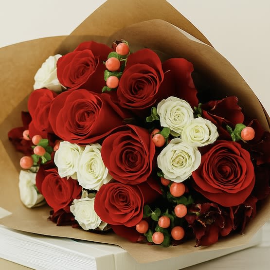 All of Me Wrapped Bouquet - The All of Me Bouquet is a stunning hand-wrapped arrangement featuring lush red roses, delicate white spray roses, and charming coffee berries. This elegant bouquet is perfect for expressing love, celebrating special moments, or surprising someone “just because.” Its vibrant colors and timeless beauty make it an ideal gift for friends, family, or that special someone, delivering warmth and heartfelt sentiment with every bloom.