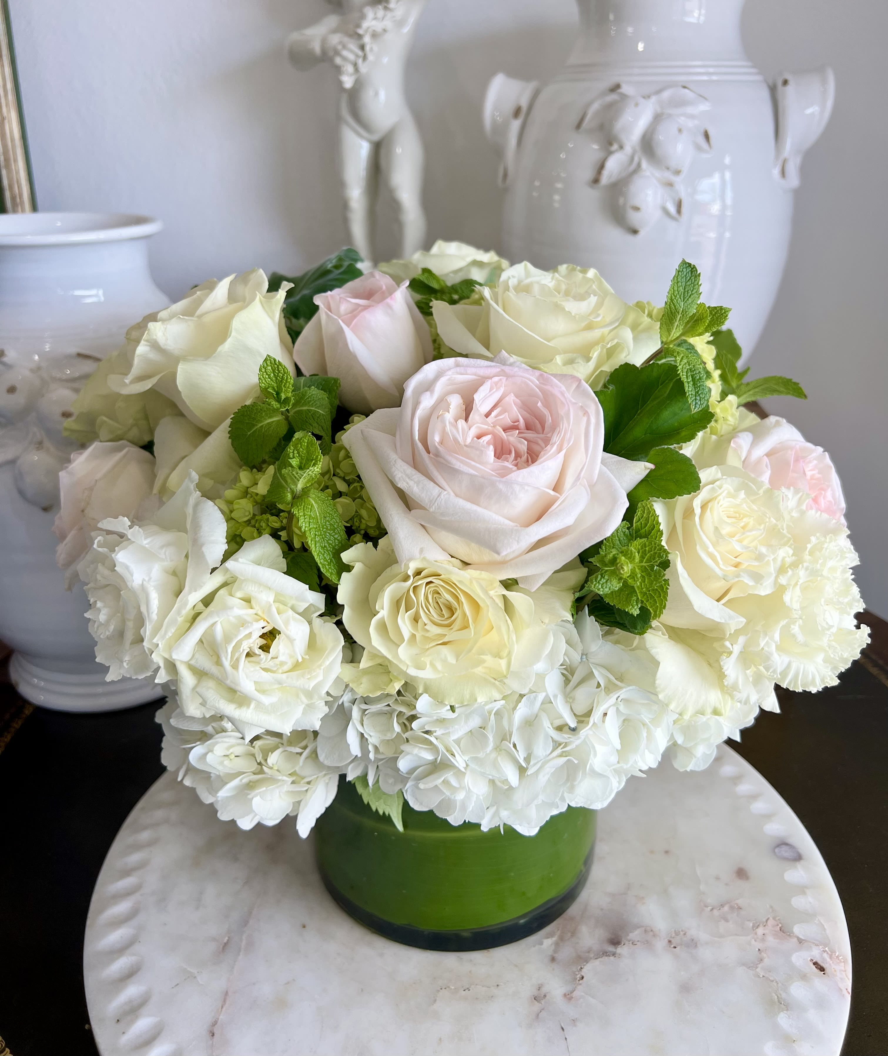 The Meghan - A beautiful array of hydrangeas, pale pink and white garden roses with a touch of mint to tantalize your senses. 