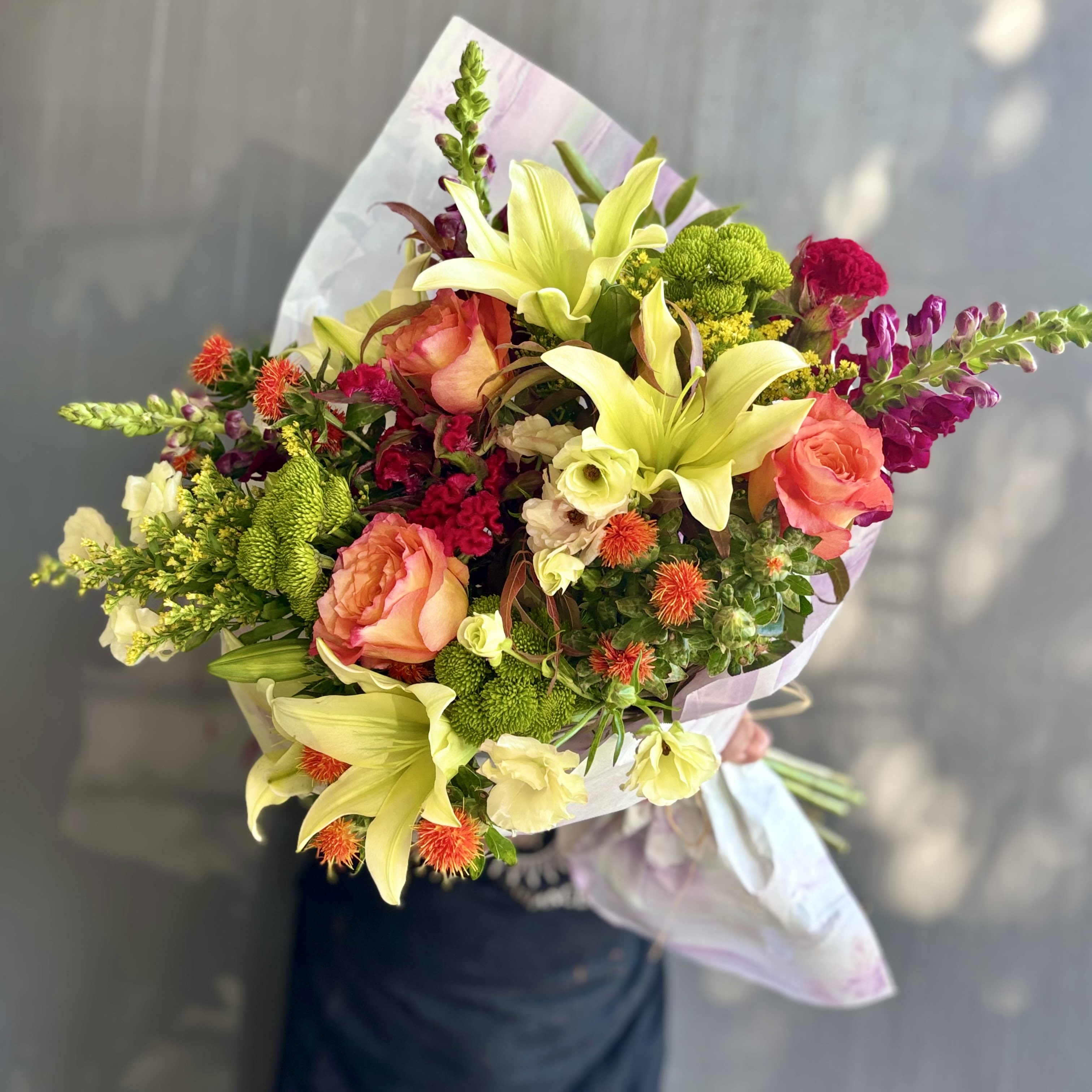 Bouquet of the Week - Always ordering flowers and want to see something new? Have enough vases at home? Just trust our creative experience? This is the perfect option for you!  Keep it fun and fresh by ordering this unique and seasonal design. Each week we will create an unique bouquet with seasonal specific flowers from the flower market. Updated Monday mornings and only available until Sunday of this week to order. Hurry or you will miss the opportunity for this beautiful design. Come Monday morning, this &quot;Design of the Week&quot; won't be available and a new arrangement will be uploaded. Enjoy the early availability of the freshest seasonal flowers and foliage we can offer!  Disclaimer: If you order the design of the week for a future date, you will receive the design at the time of ordering, not the future design option. Please check your email confirmation for the accurate photo as this design will change weekly. 