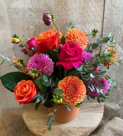 Dahlias and Roses arrangement  - Dahlias and Roses arrangement designed in a glass vase - Dahlias may vary in color and as long as they are in season close the end of September. Dahlias come in a array of colors we get them locally from our local vendor  Always will be made in a beautiful color harmony 