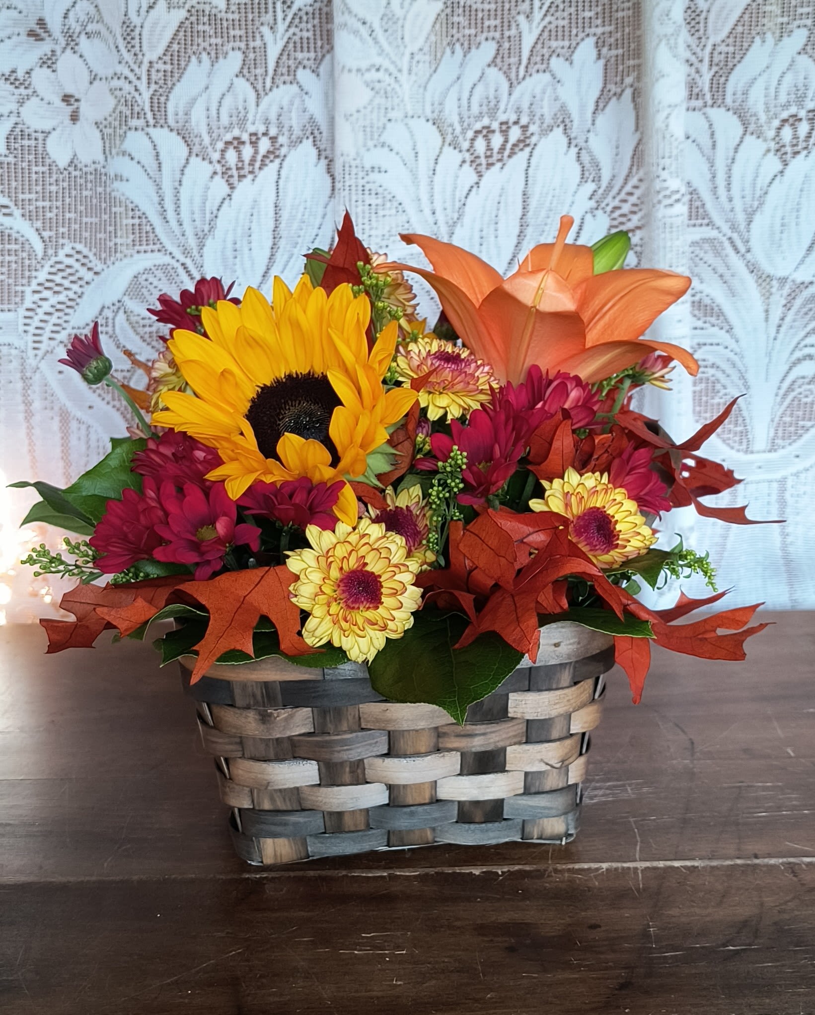 Campfire - Sending this delightful basket of fresh fall flowers to someone who's on your mind and you can be sure it will lift their spirits!